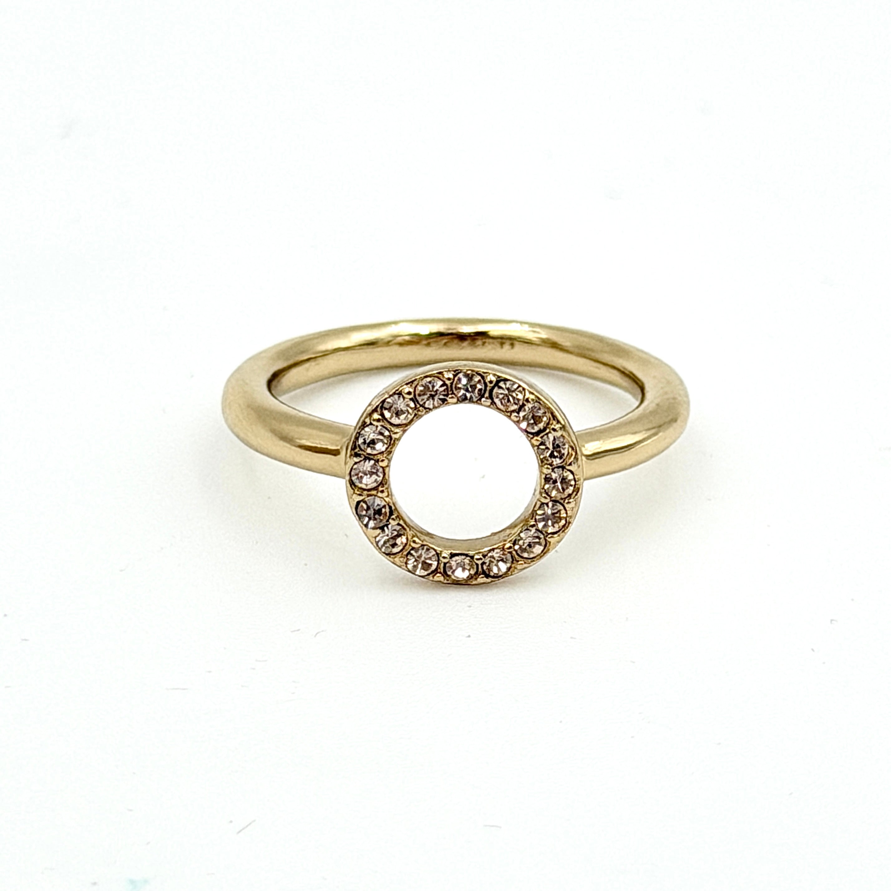 Coach Halo Crystal Ring in gold with a sparkling crystal-studded open circle on a polished gold band.