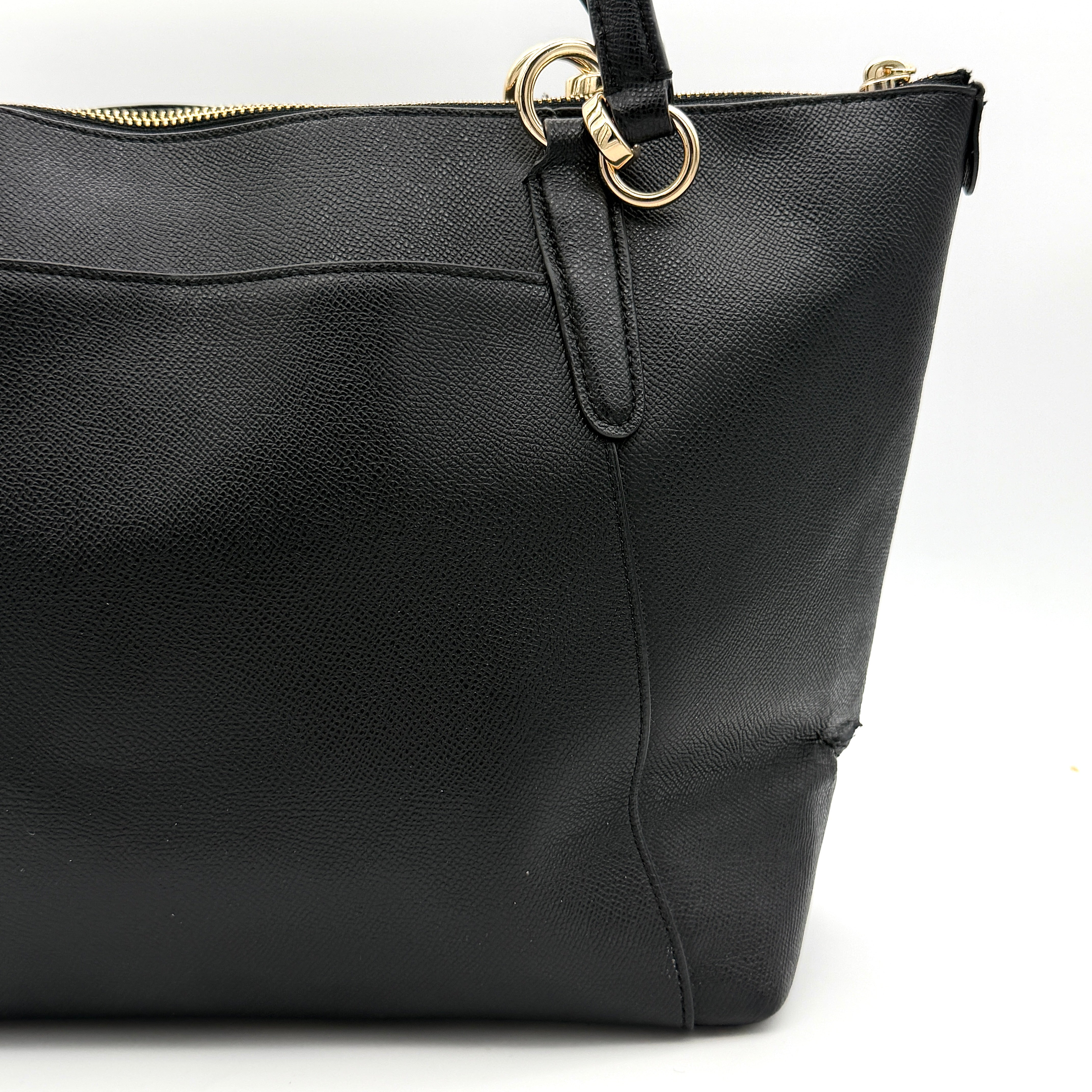 Coach Ava Leather Tote Bag in black pebbled leather with gold-tone hardware and dual top handles.