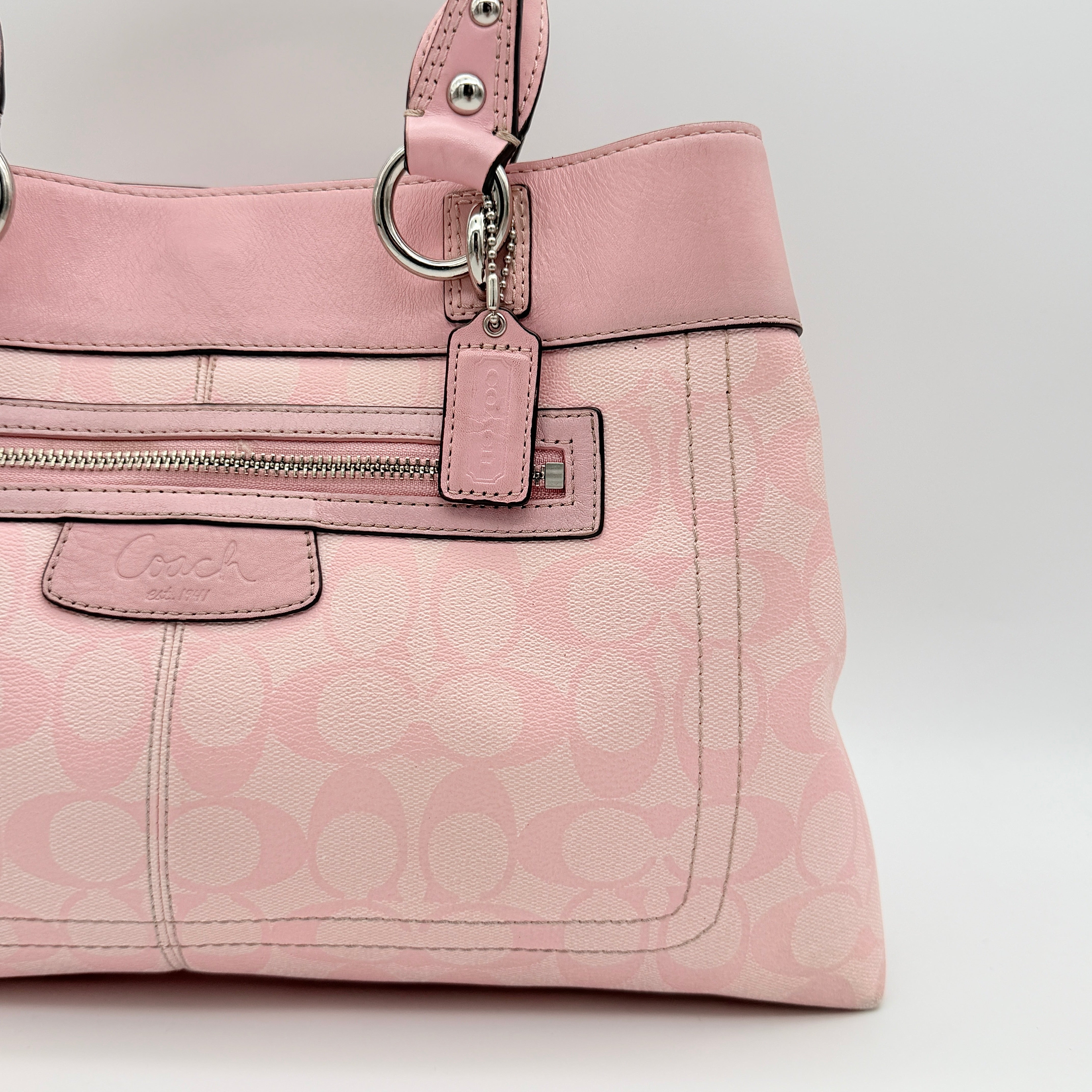 Coach Signature Penelope Shoulder Bag in pastel pink jacquard canvas with leather trim and silver-tone hardware.