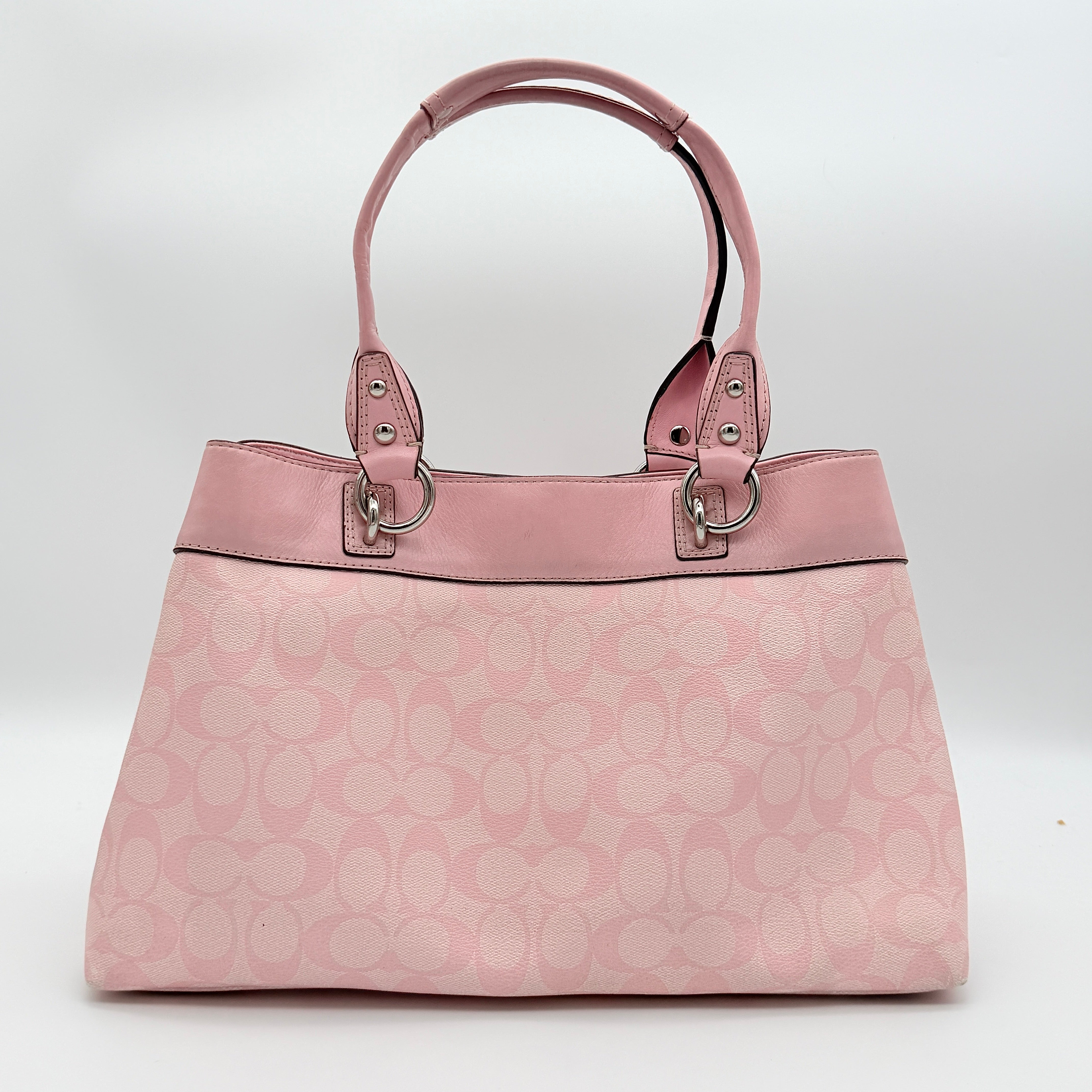 Coach Signature Penelope Shoulder Bag in pastel pink jacquard canvas with leather trim and silver-tone hardware.