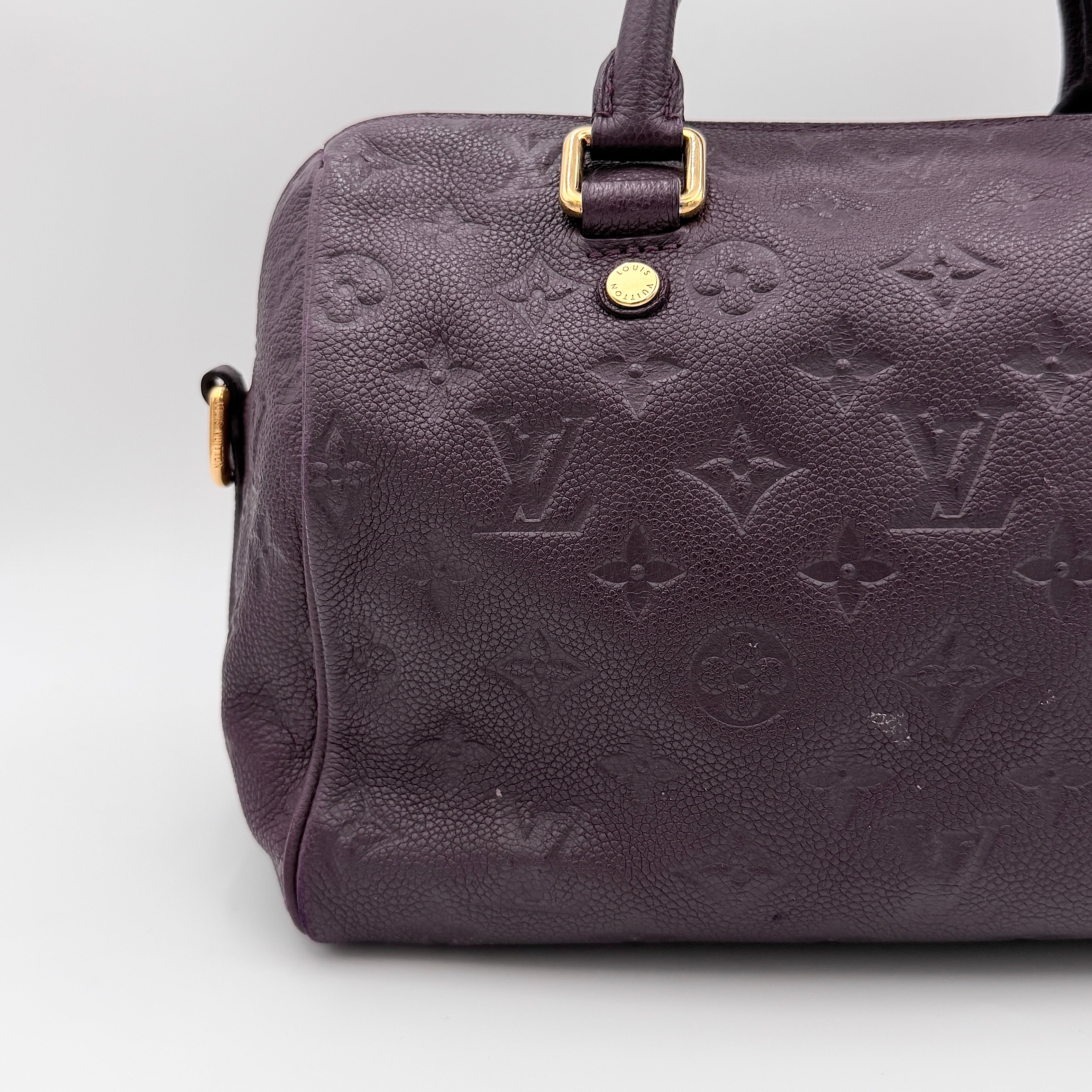 Louis Vuitton 2Way Monogram Empreinte Speedy Bandoulière 30 in deep purple grained leather with gold-tone hardware and detachable strap.