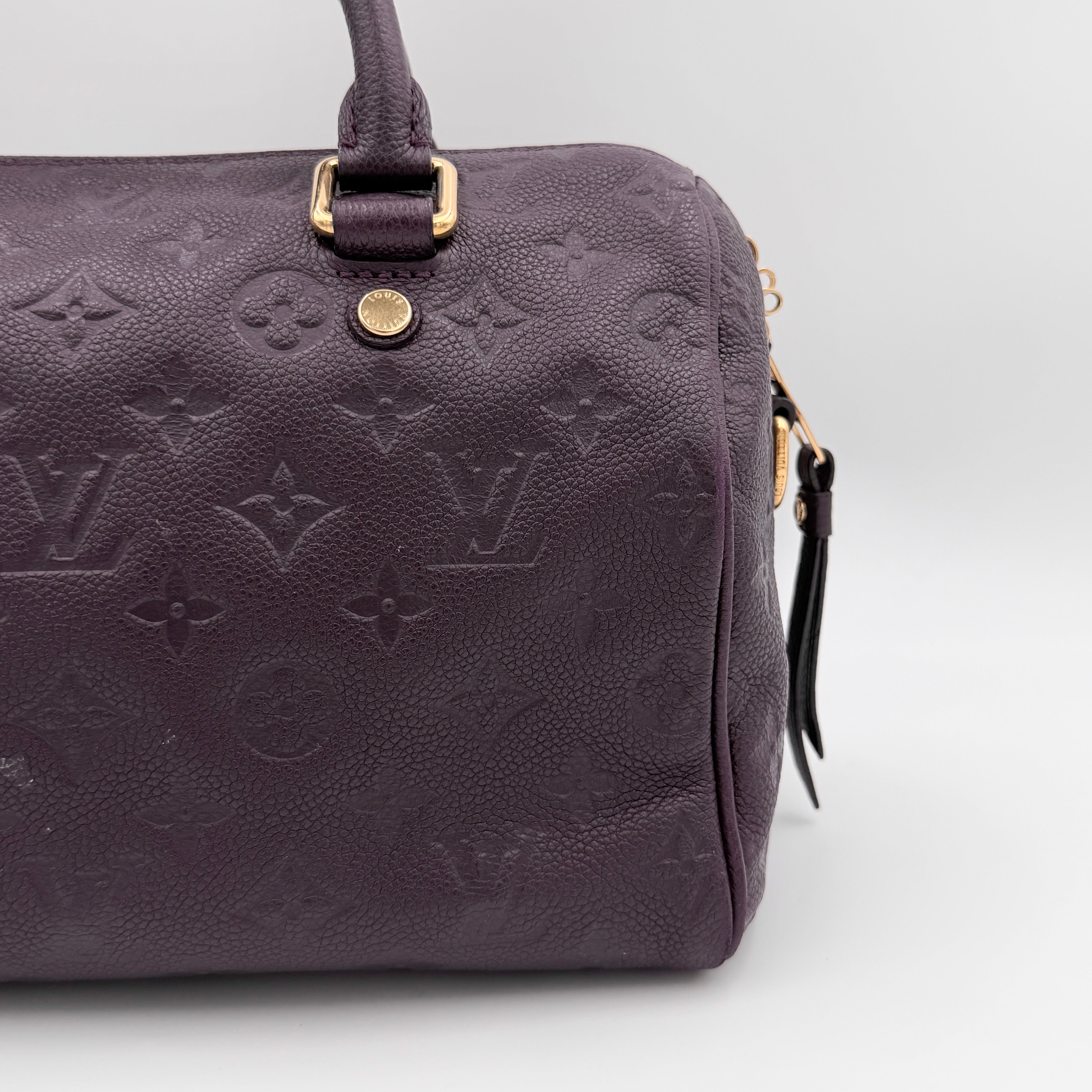 Louis Vuitton 2Way Monogram Empreinte Speedy Bandoulière 30 in deep purple grained leather with gold-tone hardware and detachable strap.