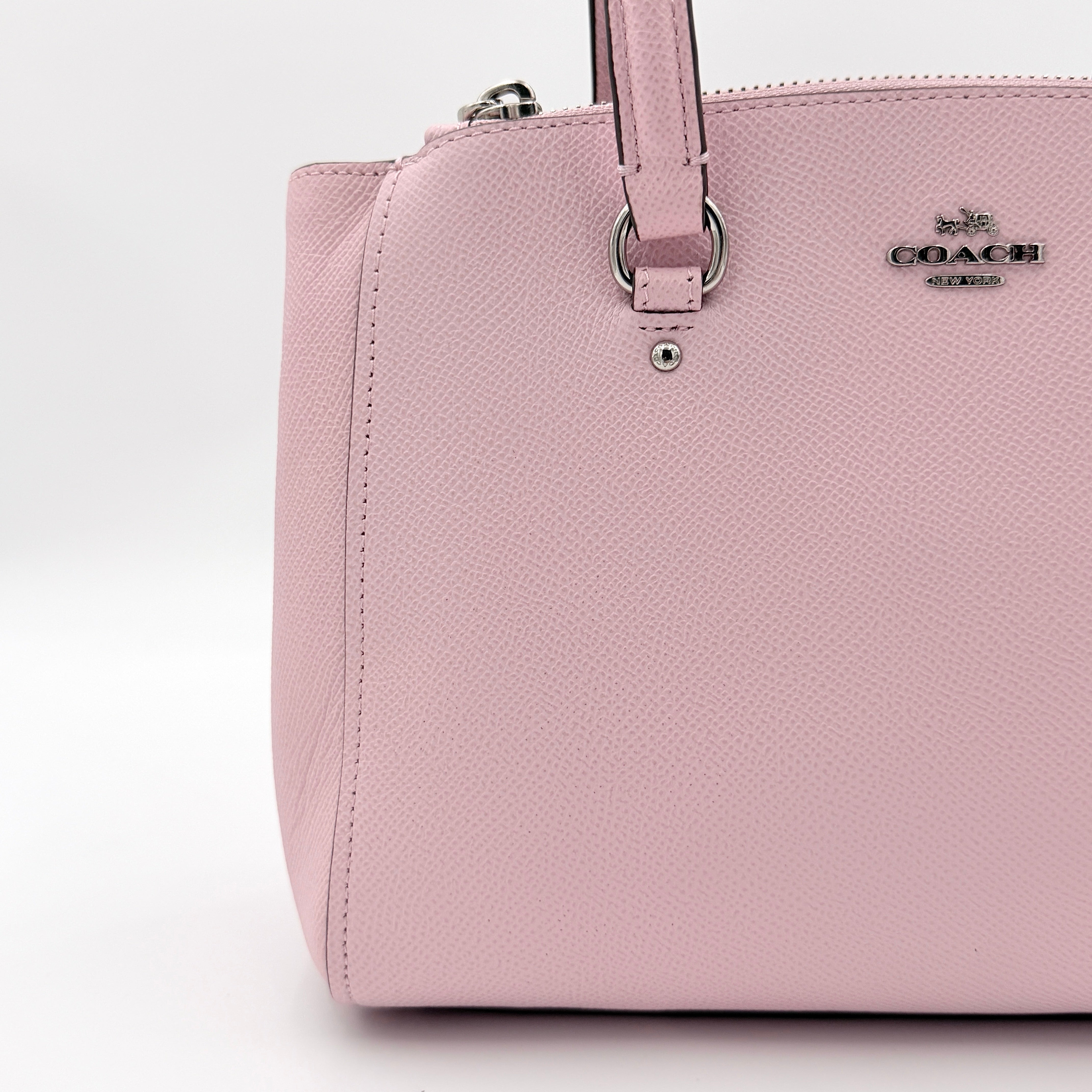 Coach Stanton 26 Carryall in blush pink grained leather with dual handles, silver hardware, and detachable strap.