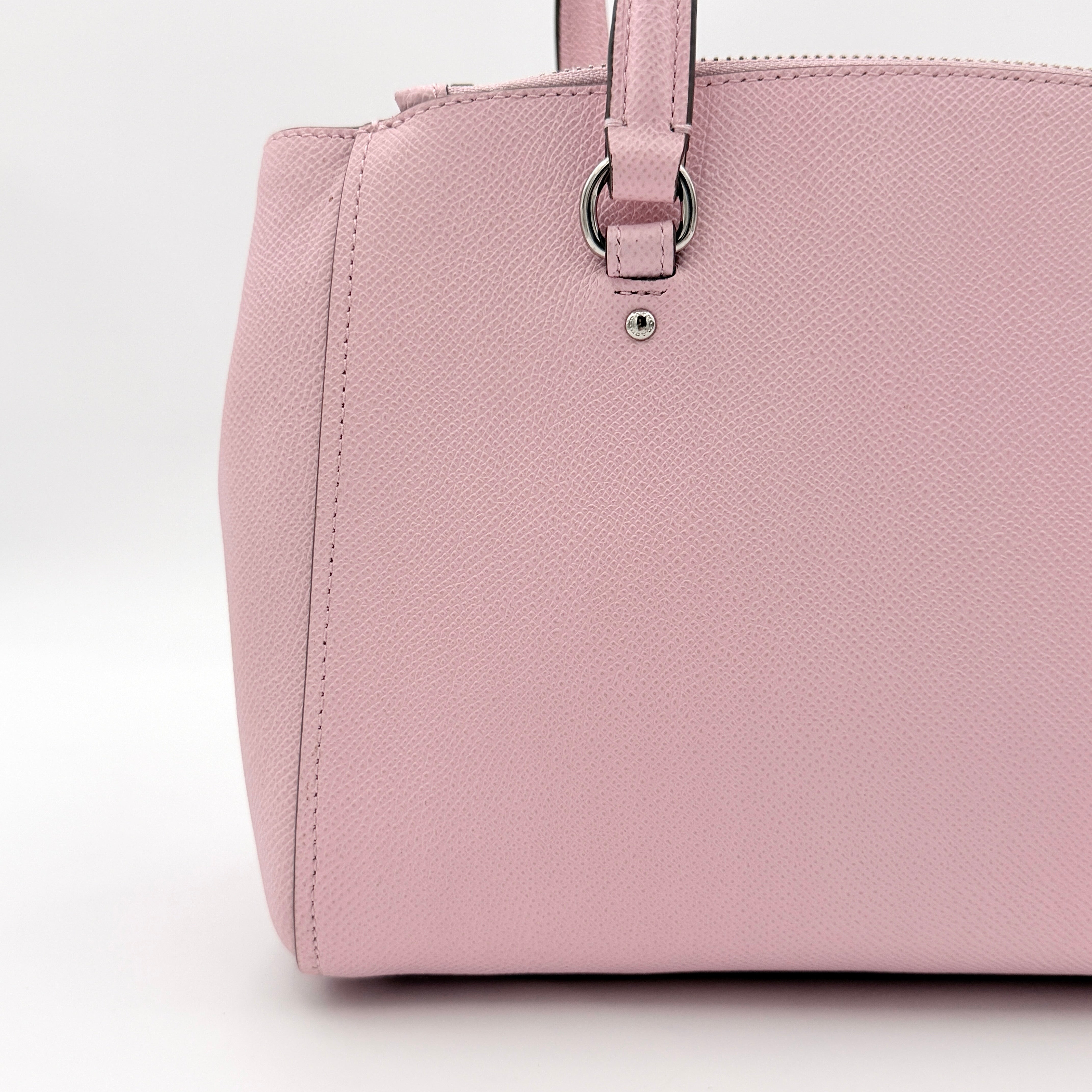 Coach Stanton 26 Carryall in blush pink grained leather with dual handles, silver hardware, and detachable strap.