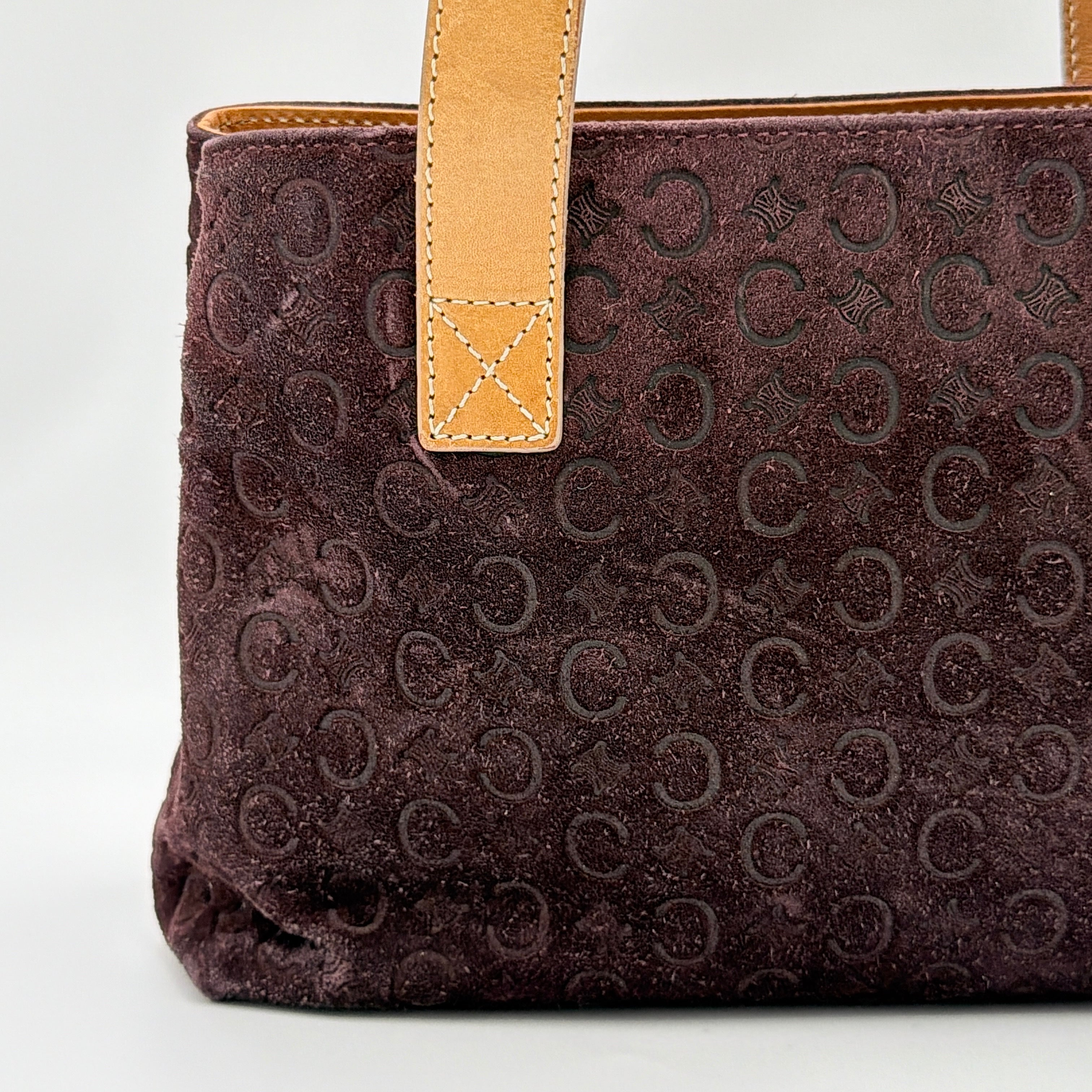 Celine C Macadam Shoulder Bag in rich brown embossed suede with tan leather handles, showcased against a plain background.