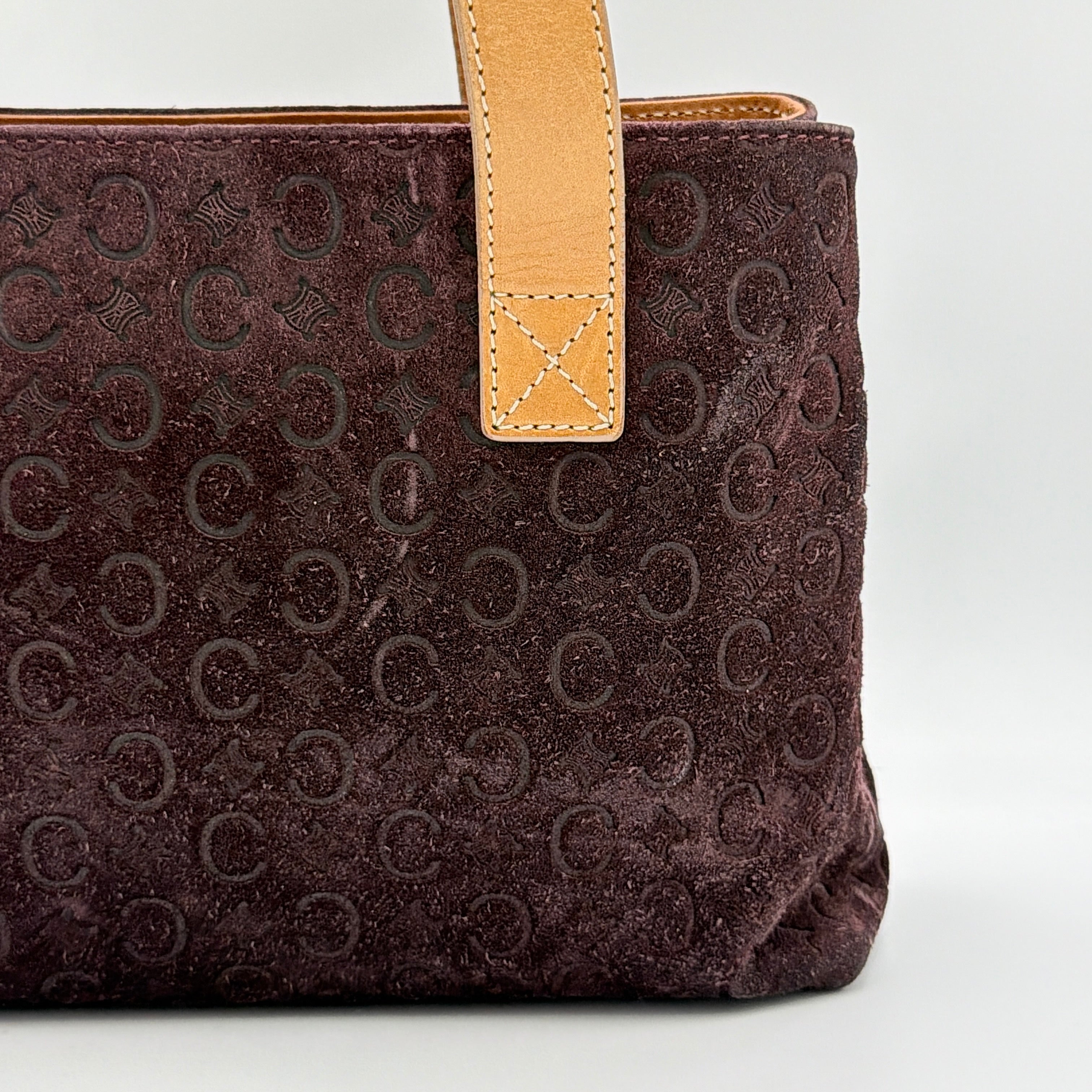 Celine C Macadam Shoulder Bag in rich brown embossed suede with tan leather handles, showcased against a plain background.