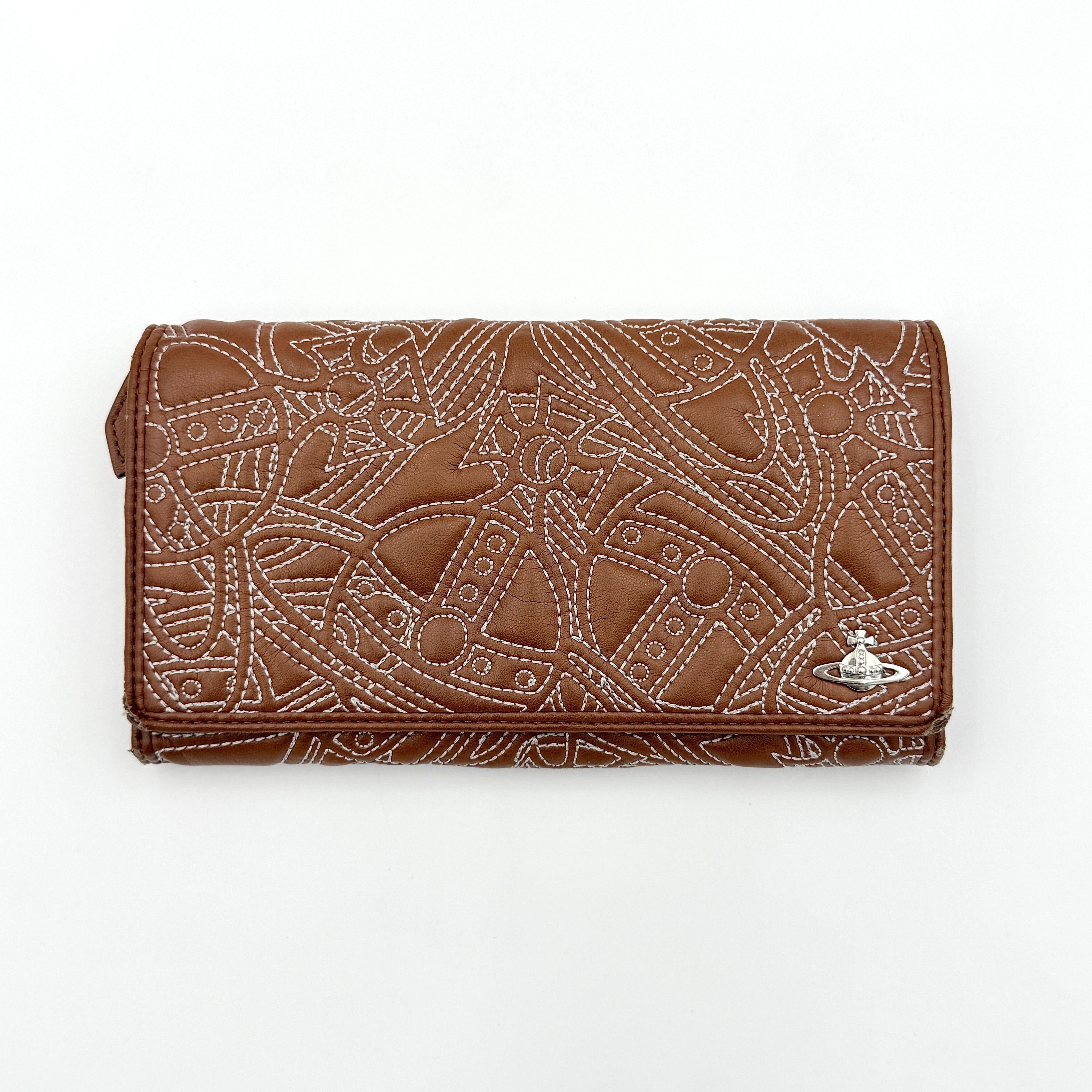 Vivienne Westwood long wallet in chestnut brown leather with white contrast stitching and silver orb embellishment.