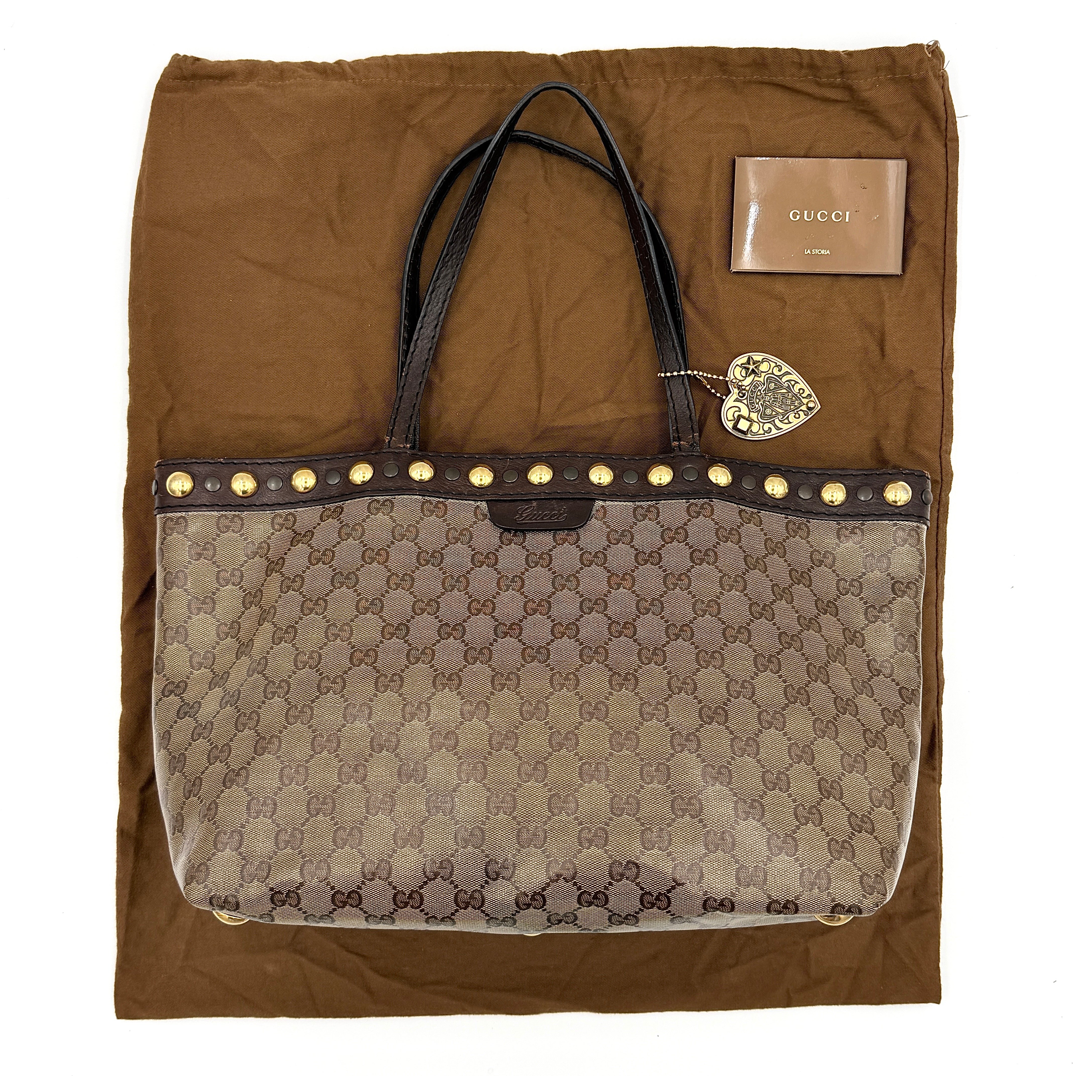 Gucci Babouska shoulder bag in GG monogram crystal canvas with gold-tone stud details and brown leather trim.