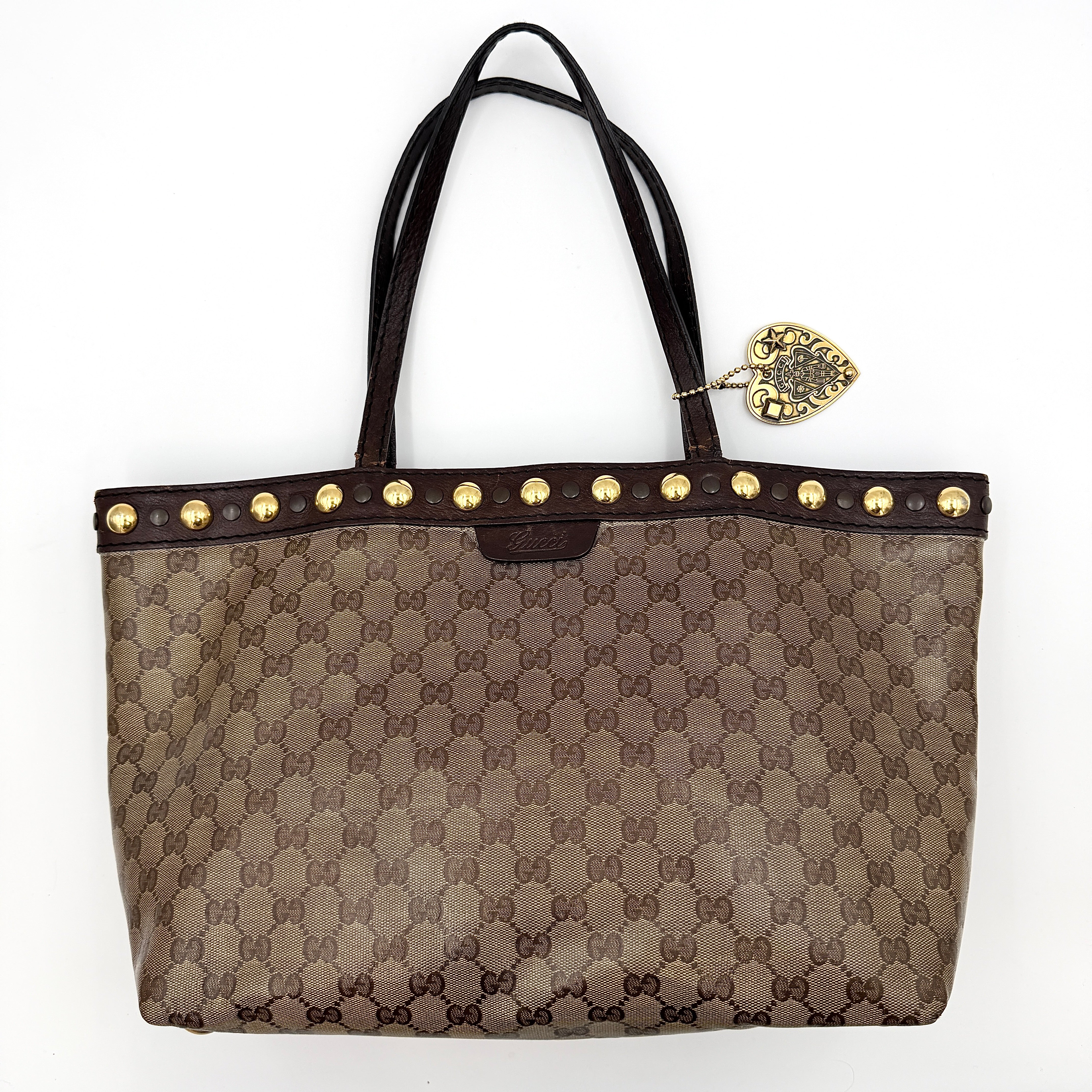 Gucci Babouska shoulder bag in GG monogram crystal canvas with gold-tone stud details and brown leather trim.