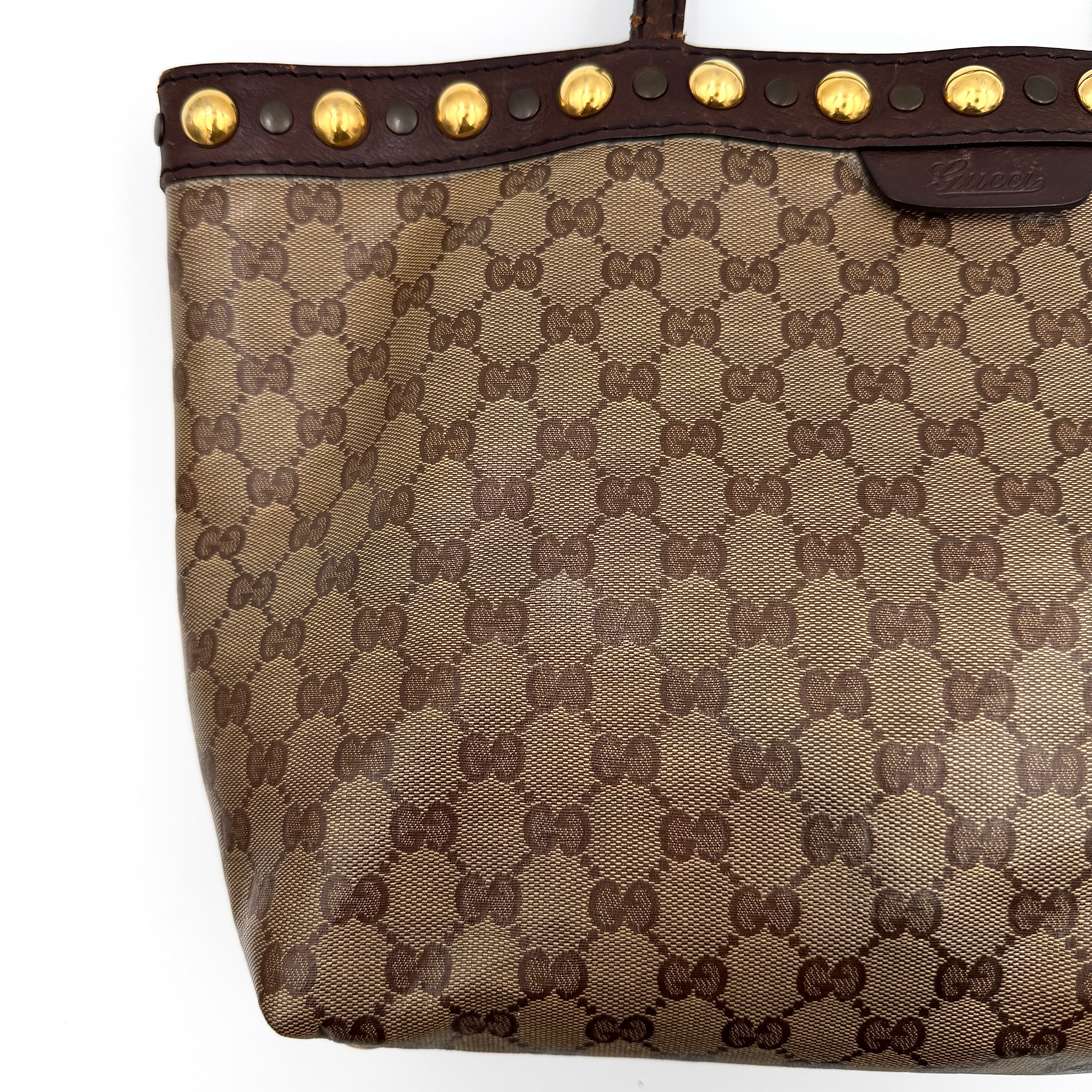 Gucci Babouska shoulder bag in GG monogram crystal canvas with gold-tone stud details and brown leather trim.