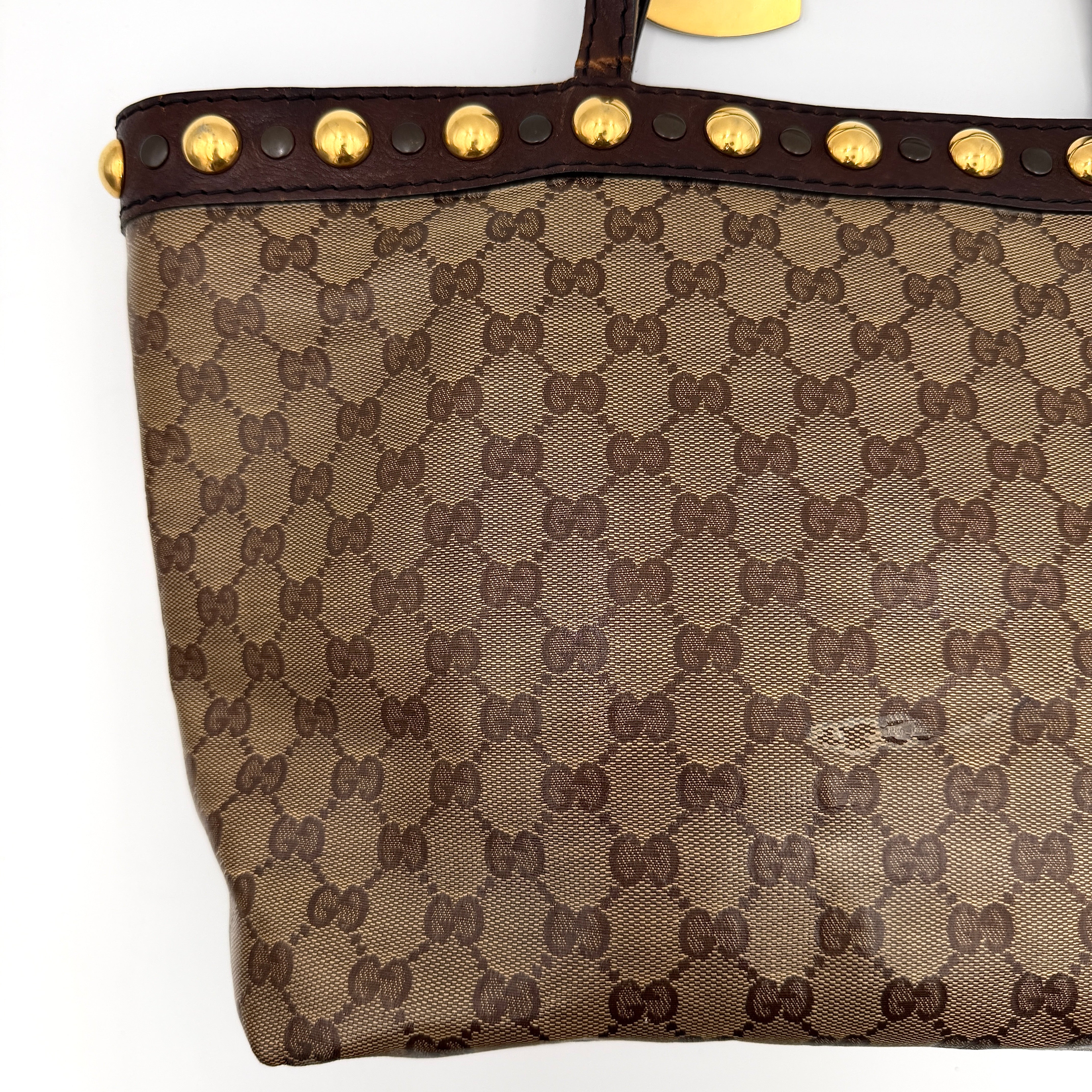 Gucci Babouska shoulder bag in GG monogram crystal canvas with gold-tone stud details and brown leather trim.