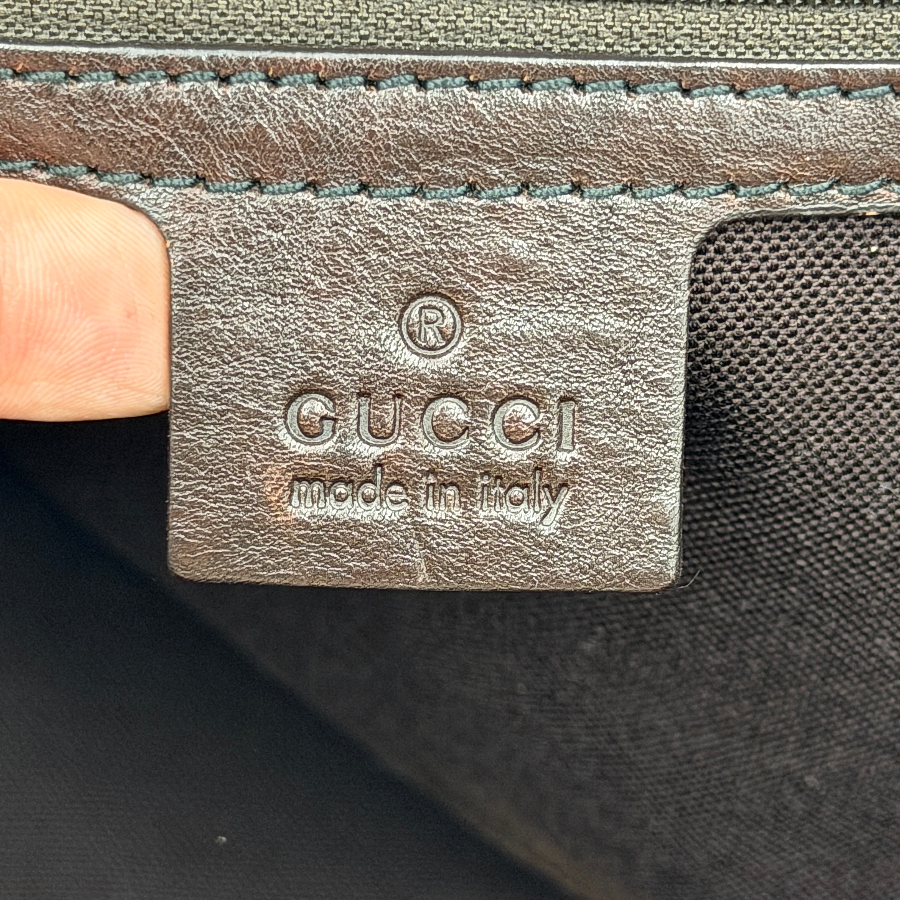 Gucci Babouska shoulder bag in GG monogram crystal canvas with gold-tone stud details and brown leather trim.