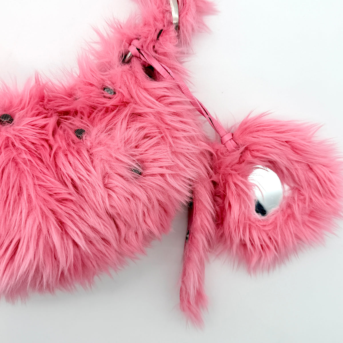 Balenciaga XS Le Cagole Shoulder Bag in sweet pink faux fur with heart-shaped mirror charm and silver hardware, styled on its original dust bag.