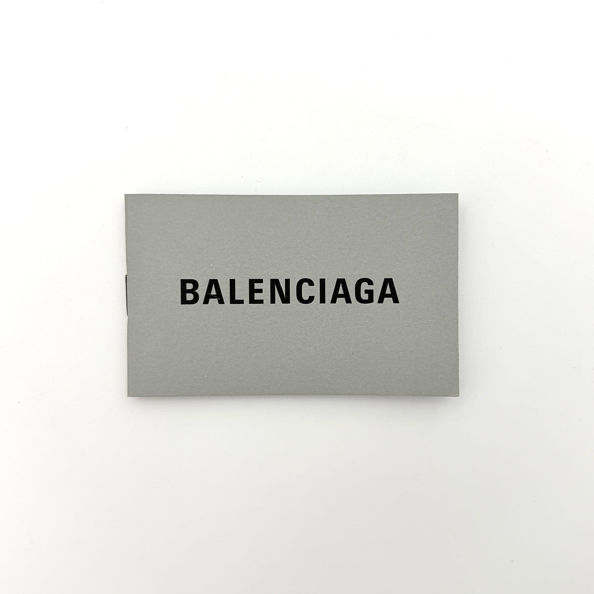 Balenciaga XS Le Cagole Shoulder Bag in sweet pink faux fur with heart-shaped mirror charm and silver hardware, styled on its original dust bag.