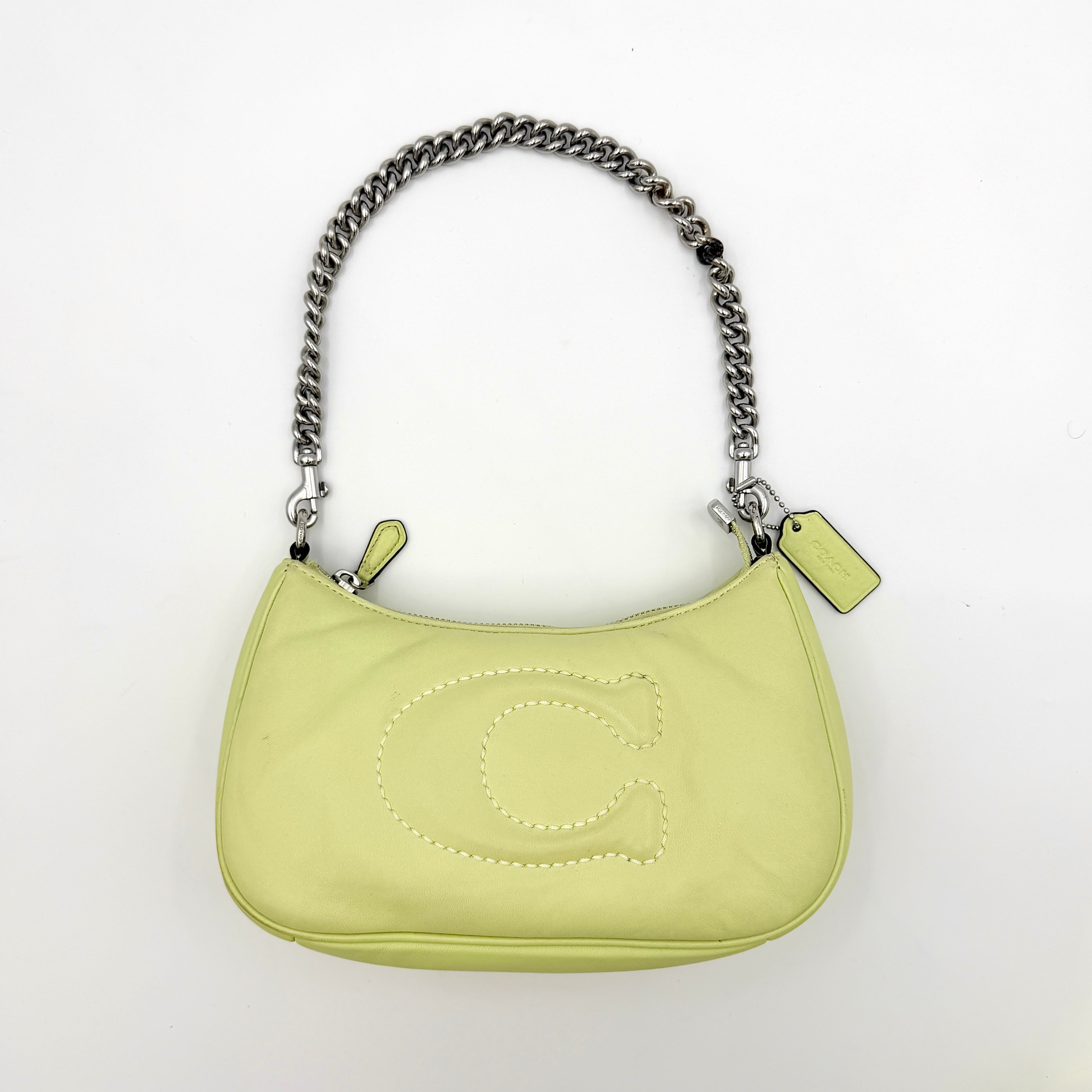 Coach 2Way C Teri Quilted Shoulder Bag in pastel green leather with oversized chain handle and detachable strap, displayed against a clean background.
