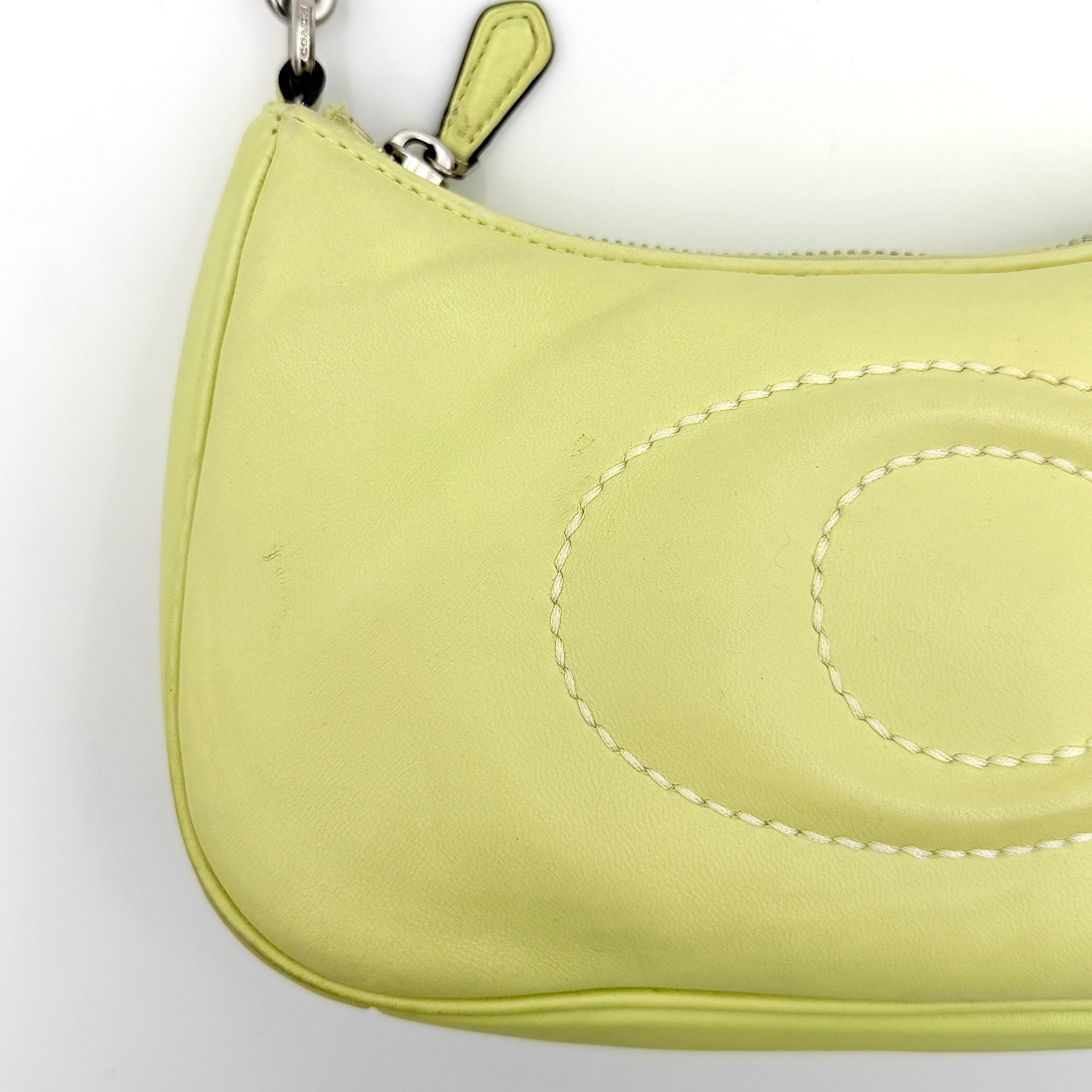 Coach 2Way C Teri Quilted Shoulder Bag in pastel green leather with oversized chain handle and detachable strap, displayed against a clean background.