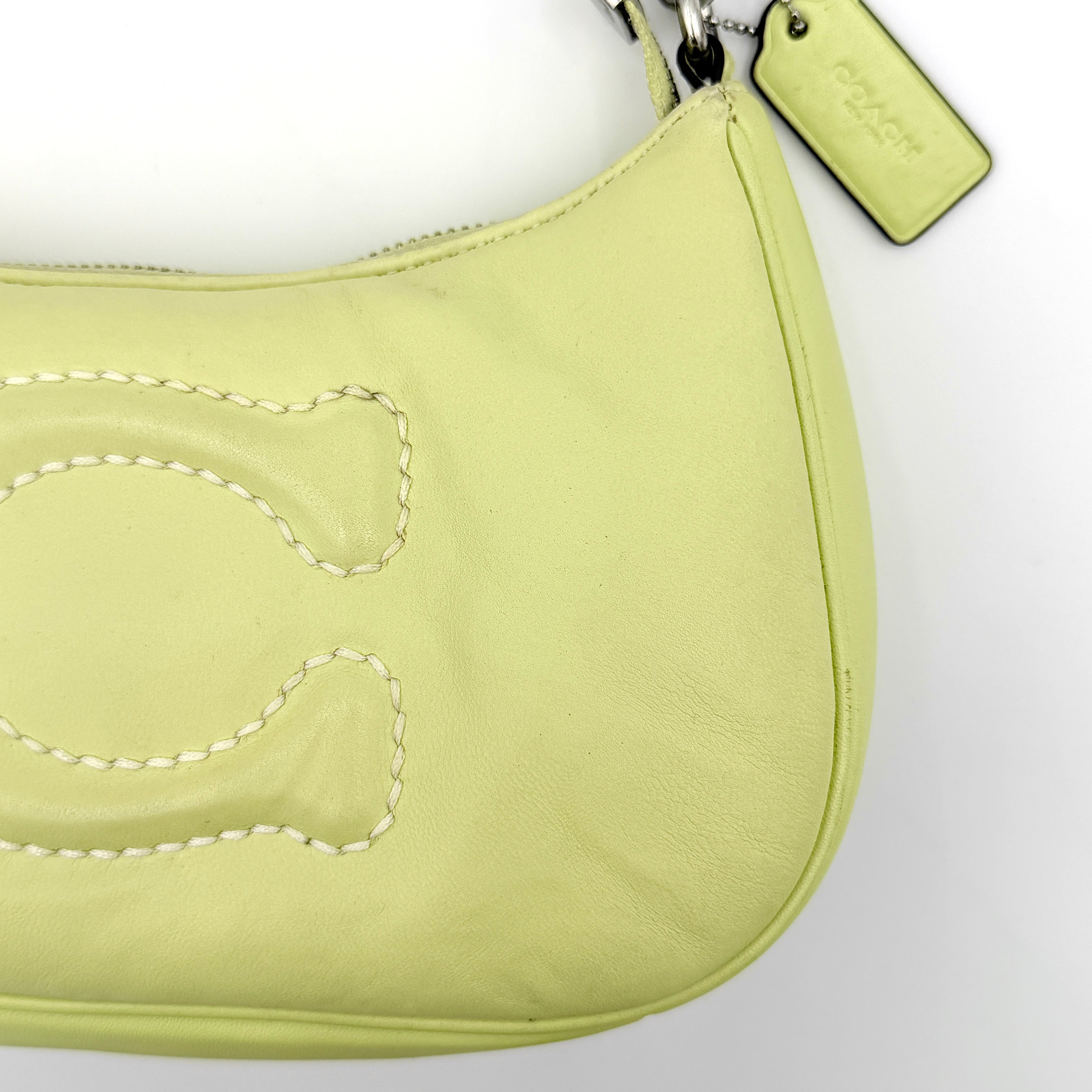Coach 2Way C Teri Quilted Shoulder Bag in pastel green leather with oversized chain handle and detachable strap, displayed against a clean background.
