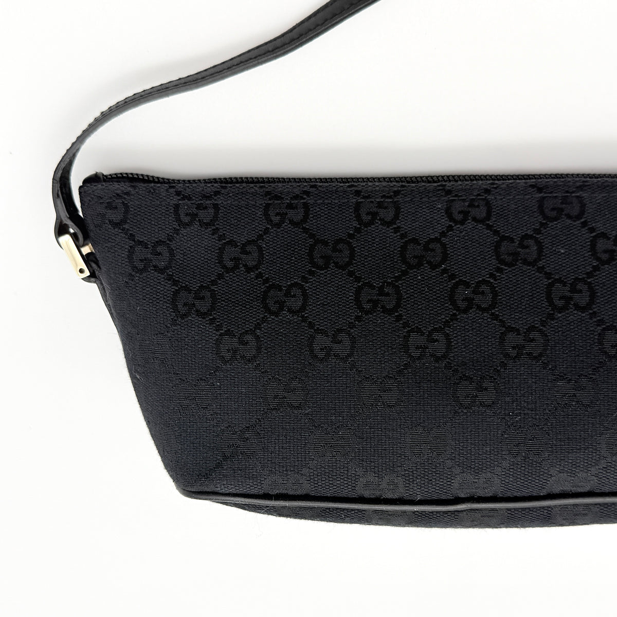 Gucci GG Monogram Pochette Boat Shoulder Bag in black GG jacquard with gold-tone hardware and black leather trim displayed with dust bag.
