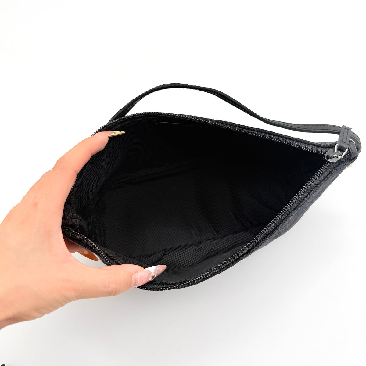 Gucci GG Monogram Pochette Boat Shoulder Bag in black GG jacquard with gold-tone hardware and black leather trim displayed with dust bag.