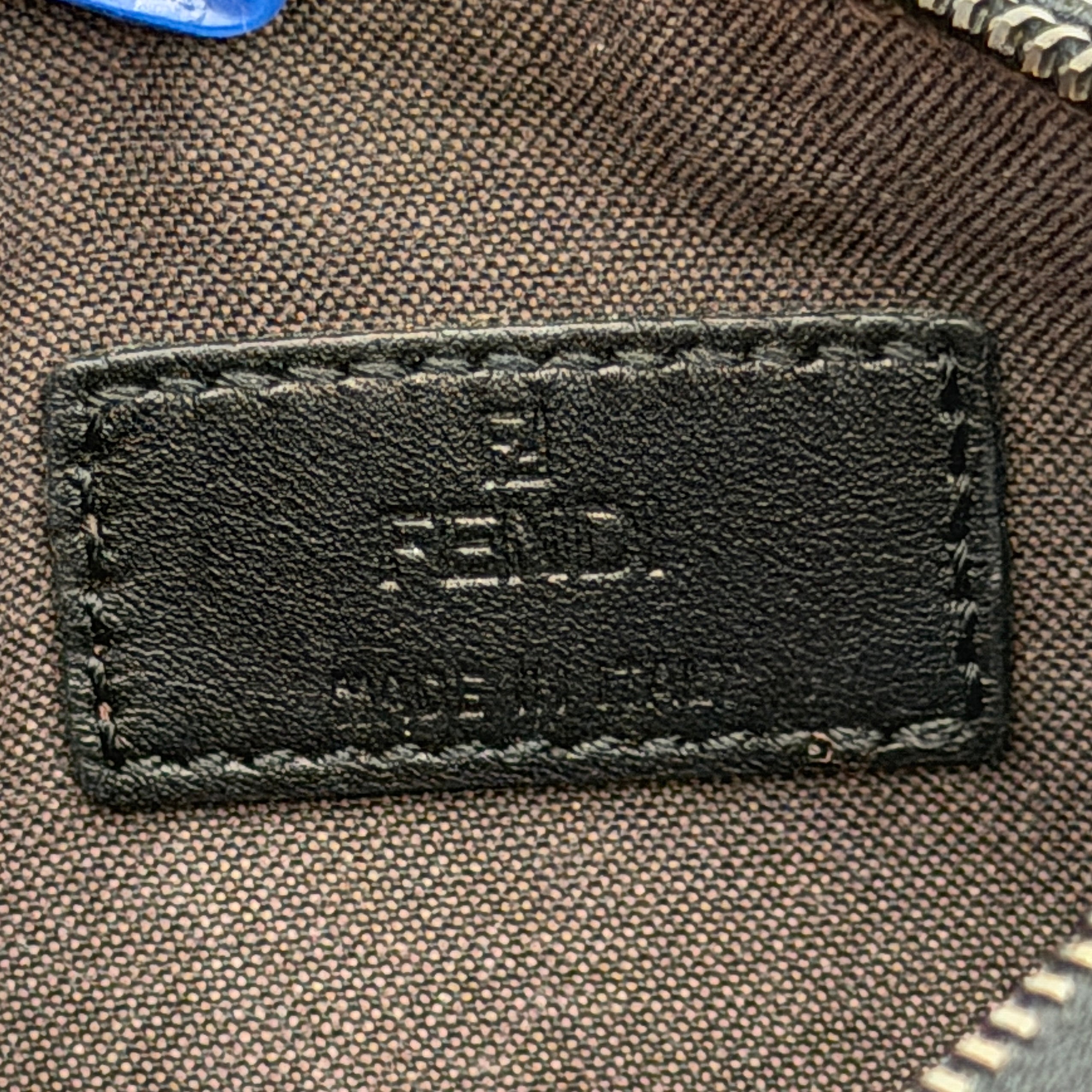 Fendi FF Zucca Coin Purse in black jacquard with iconic monogram pattern, silver-tone chain and carabiner detail.