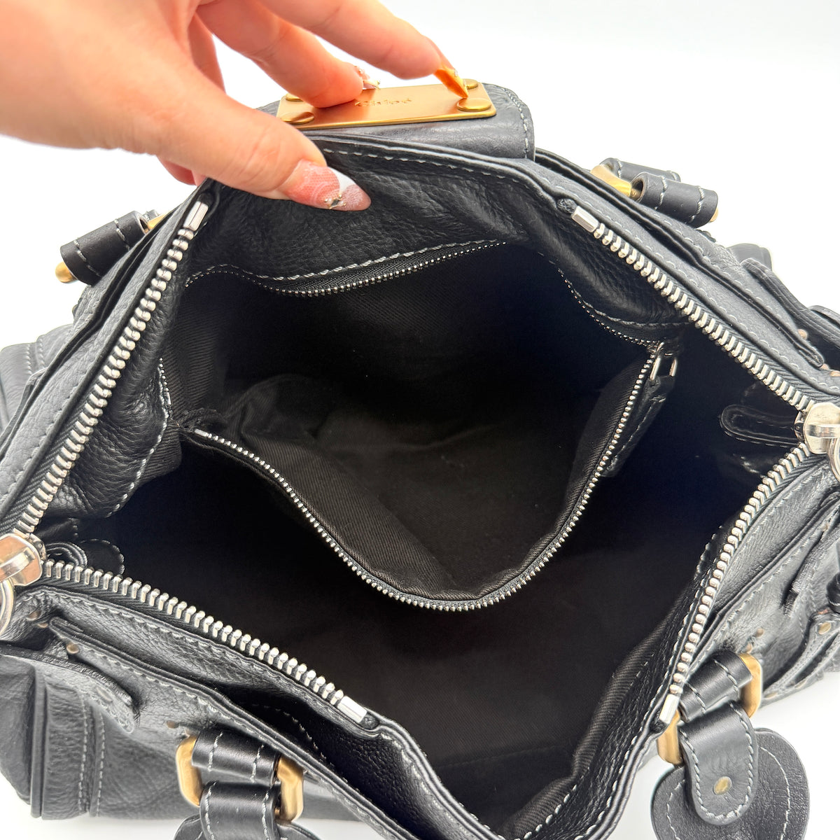 Front view of the Chloe Paddington Shoulder Bag in black leather with gold-tone hardware and signature padlock.