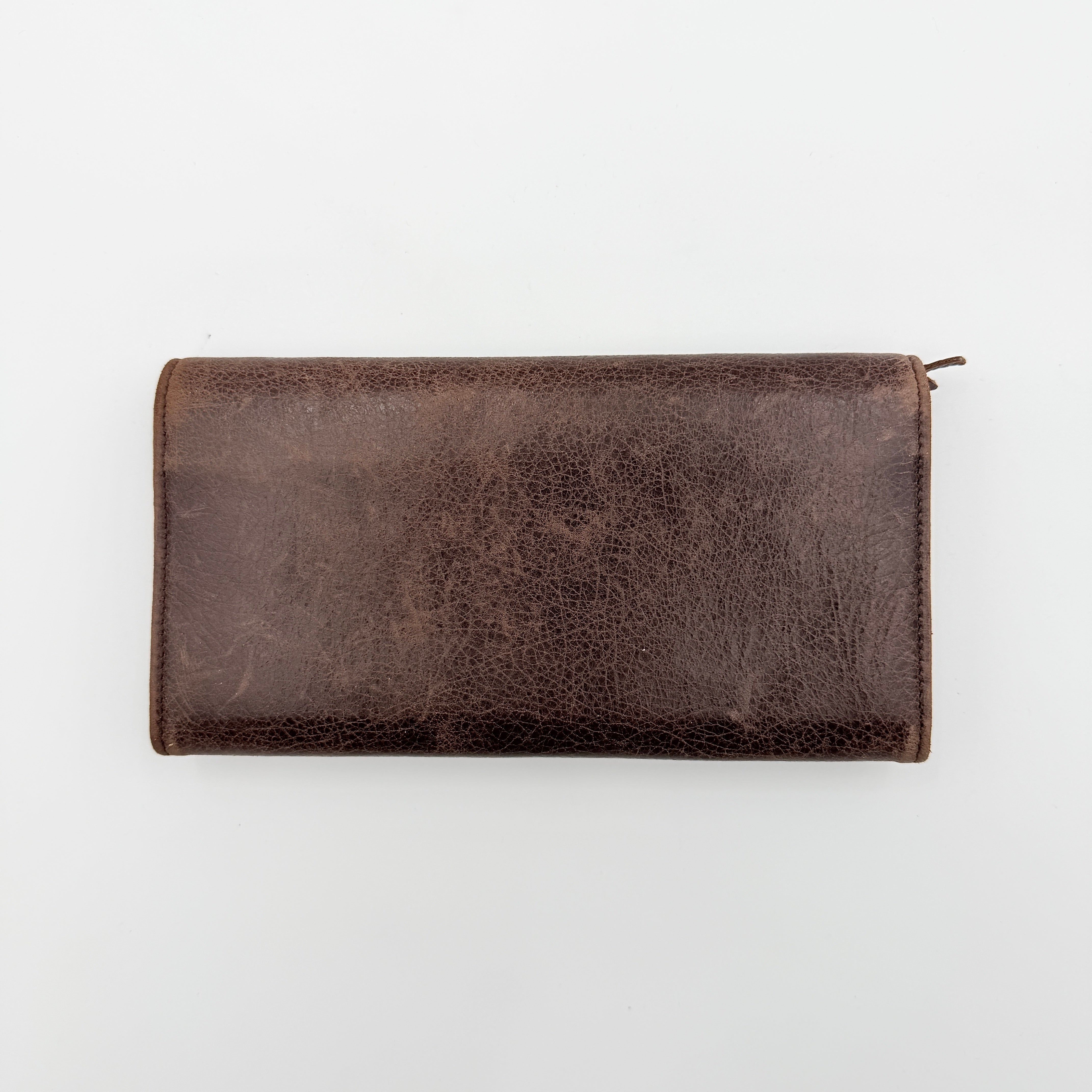 Balenciaga City Leather Long Wallet in brown distressed leather with signature buckle and zip detailing.