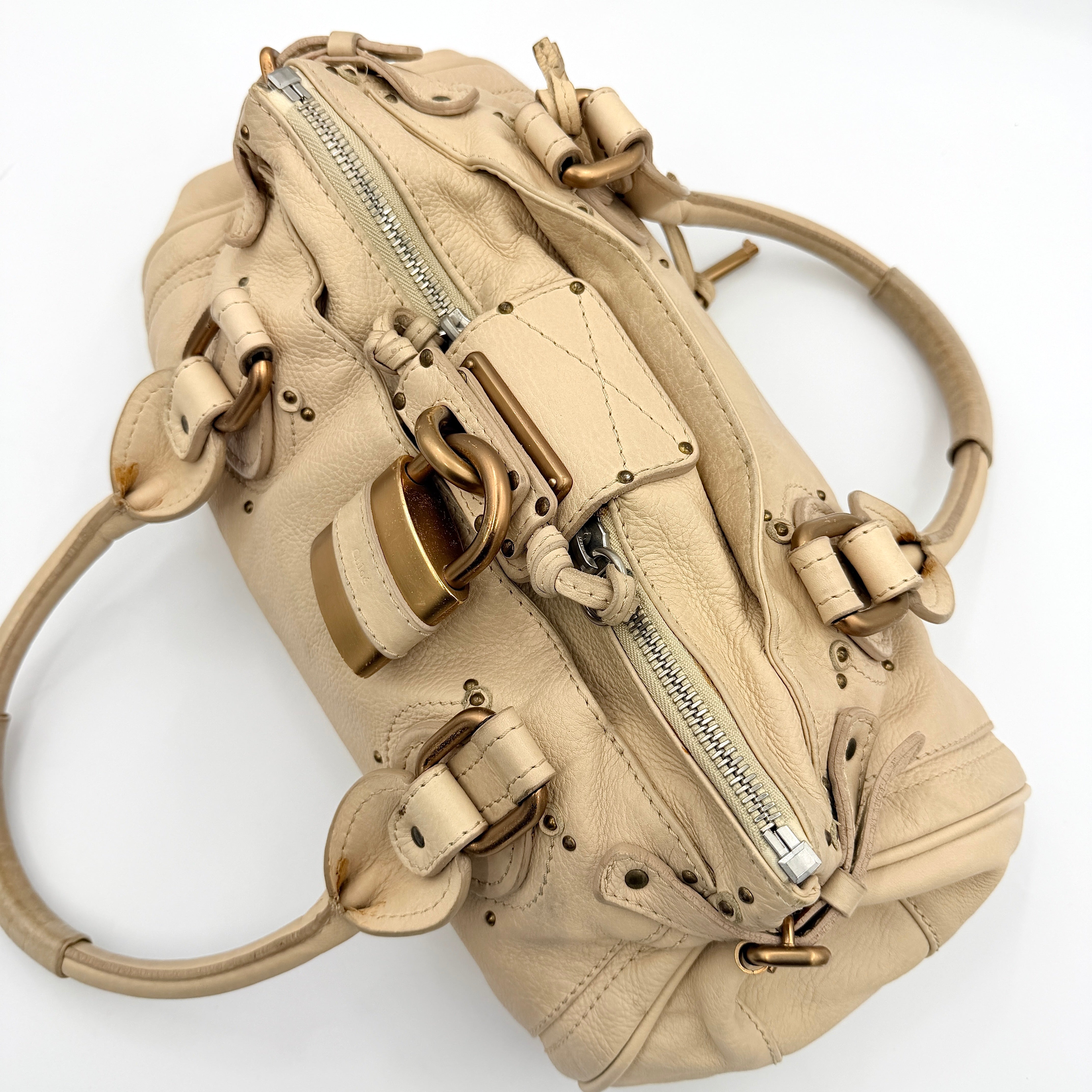 Chloé Paddington Shoulder Bag in ivory leather with signature brass padlock and double rolled handles.