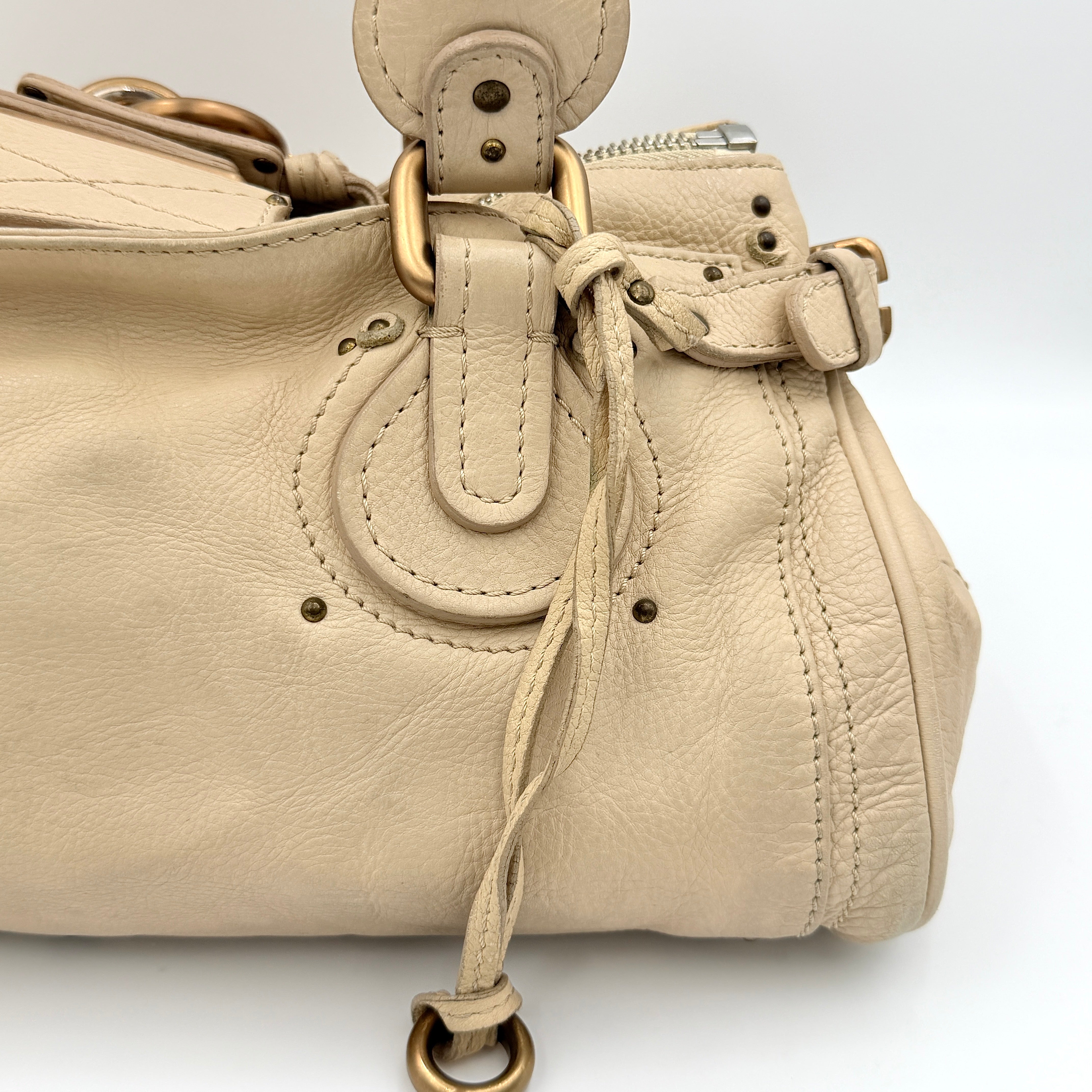 Chloé Paddington Shoulder Bag in ivory leather with signature brass padlock and double rolled handles.