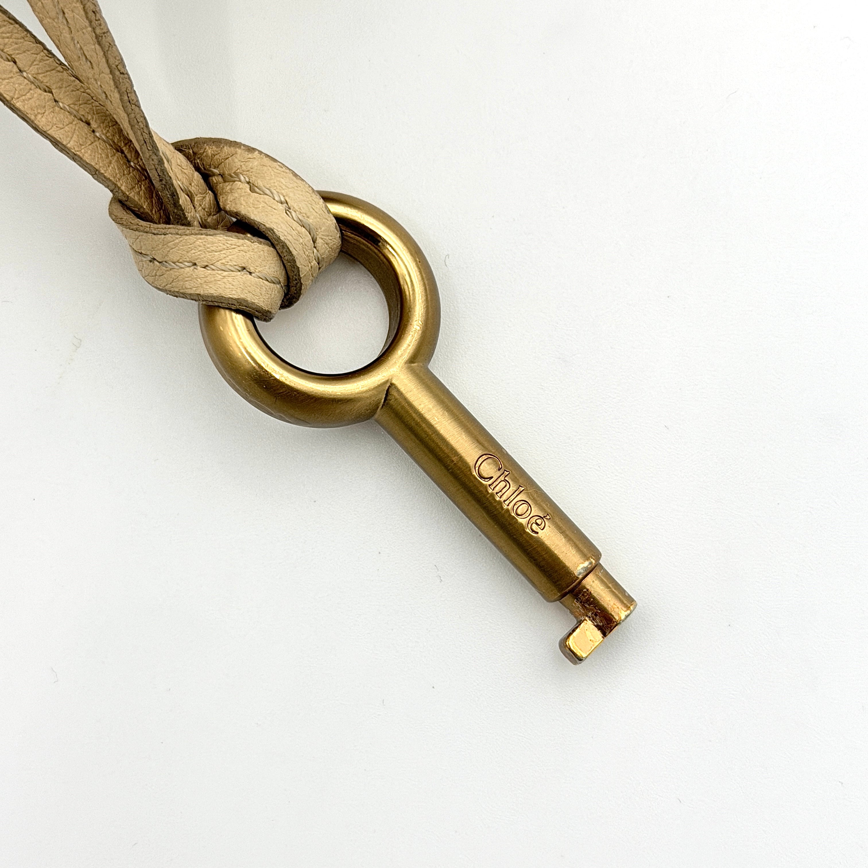 Chloé Paddington Shoulder Bag in ivory leather with signature brass padlock and double rolled handles.
