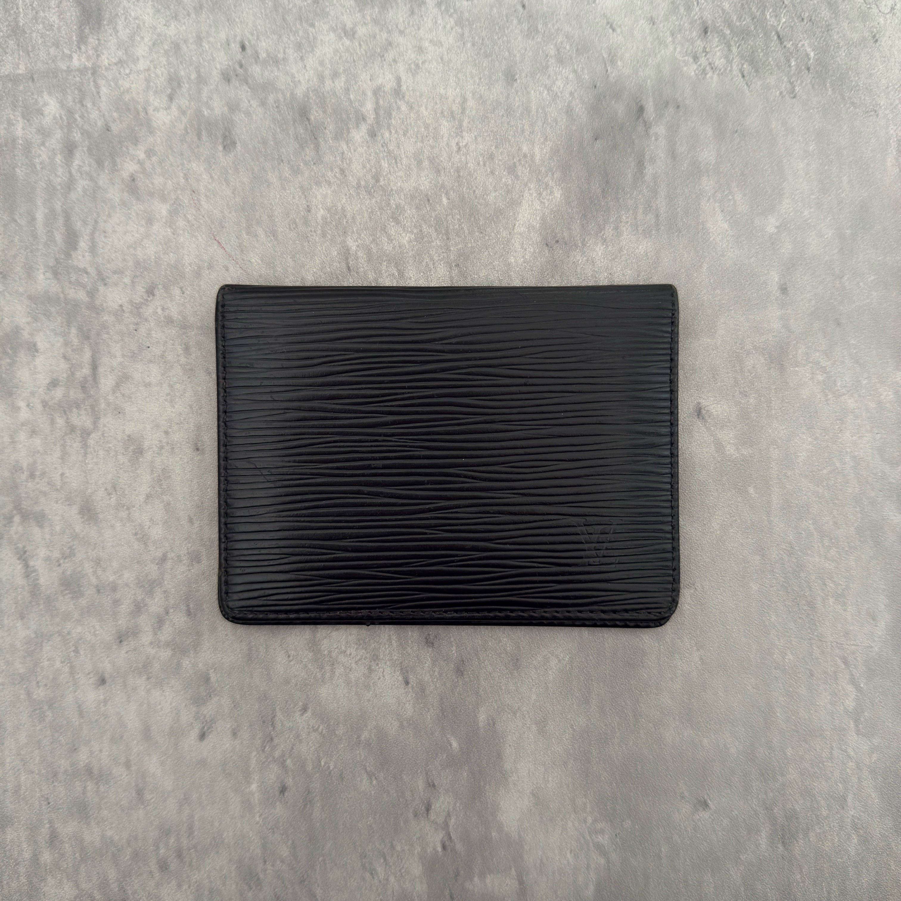 Louis Vuitton Epi Black Cardholder in black Epi leather, featuring dual transparent card slots and a slim, elegant design.