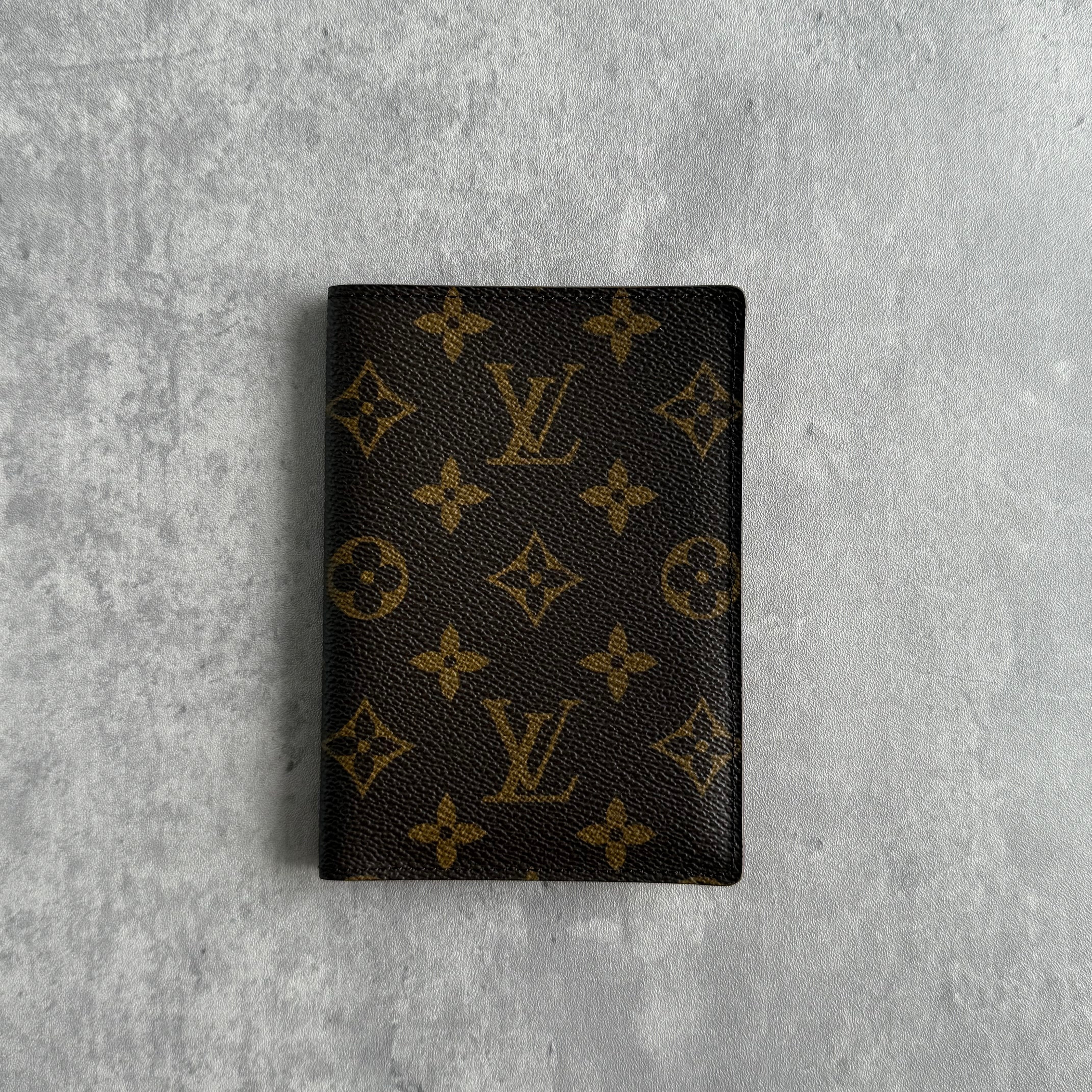 Louis Vuitton Monogram Canvas Passport Cover in brown with LV monogram and brown leather interior, made in France.