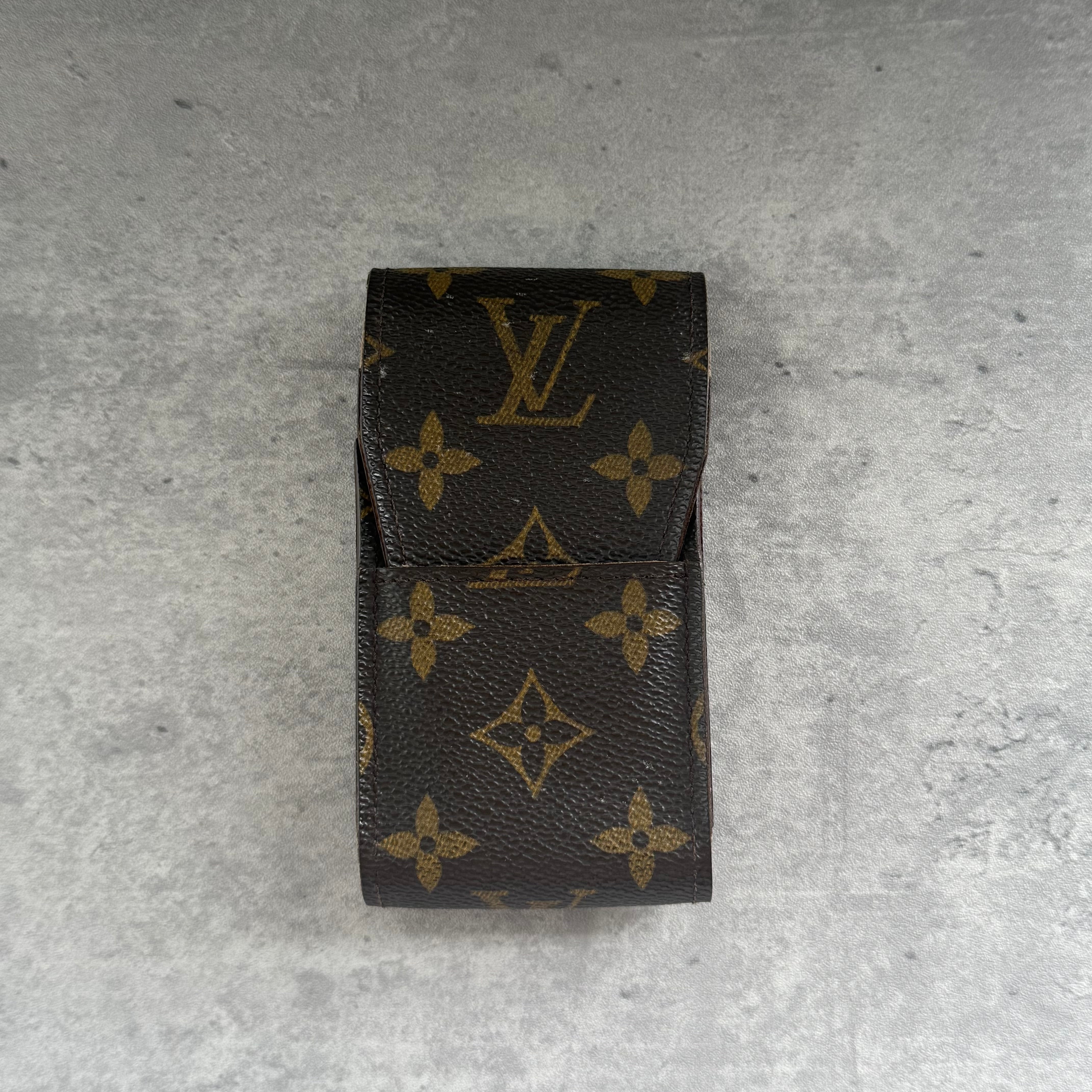 Louis Vuitton Monogram Cigarette Case in brown coated canvas with classic LV monogram pattern and flap closure.