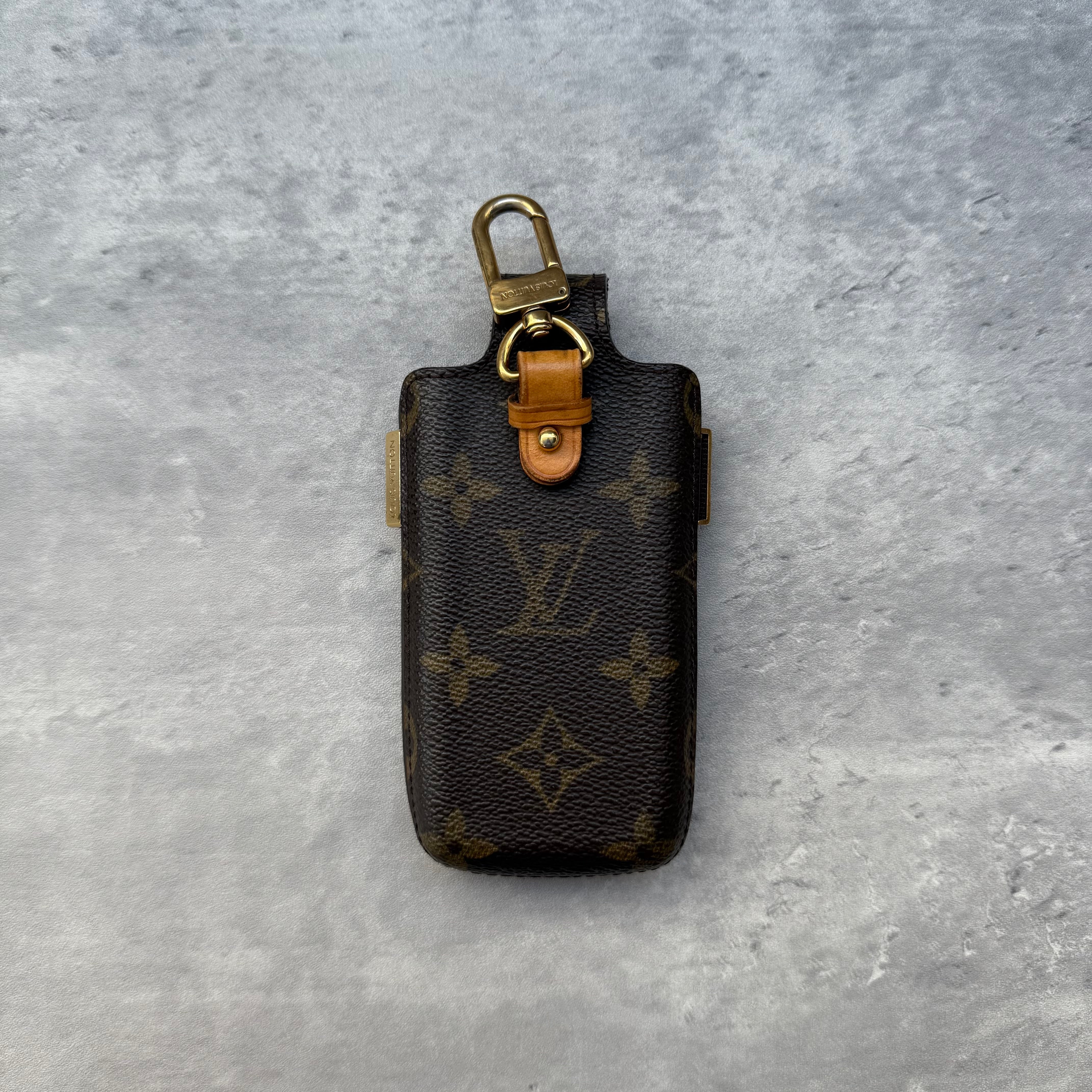 Louis Vuitton Monogram Etui Accessory Case in brown coated canvas with leather trim and gold-tone hardware.