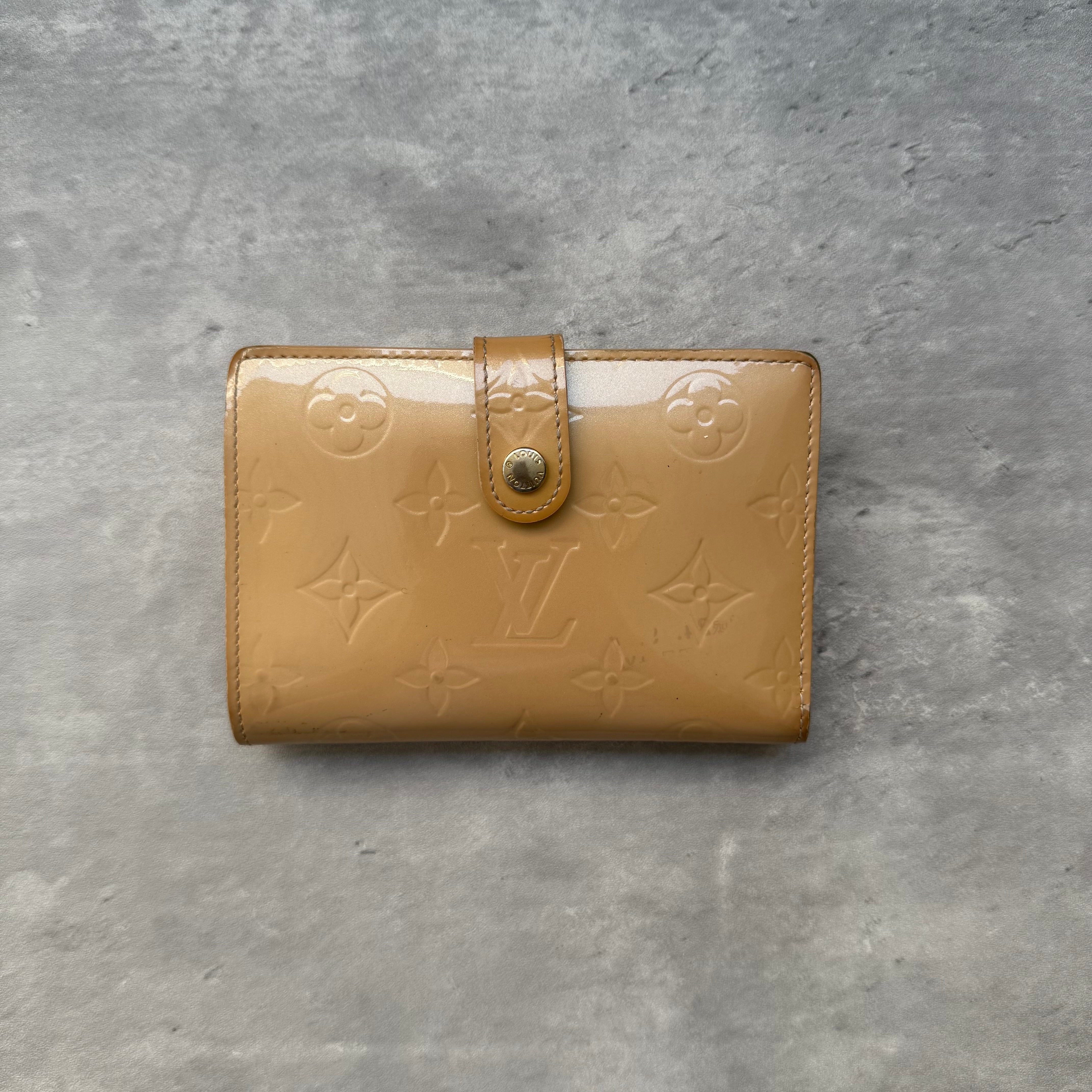 Louis Vuitton Monogram Vernis Kisslock Wallet in tan patent leather, embossed with LV monogram, featuring gold-tone kisslock closure and multiple compartments.