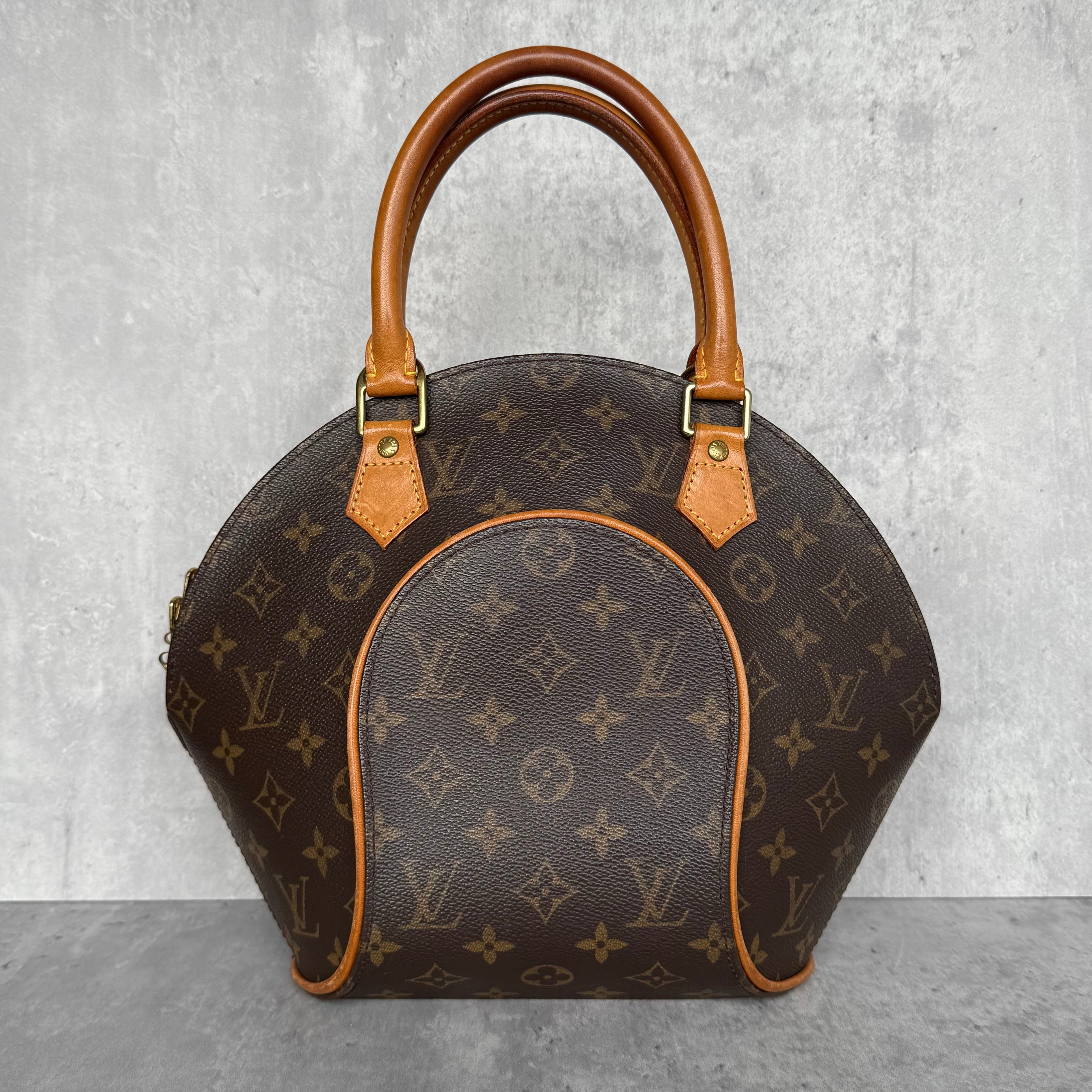 Louis Vuitton PM Monogram Ellipse Handbag with Vachetta leather trim, double handles, and brown canvas interior featuring slip pocket and D-ring