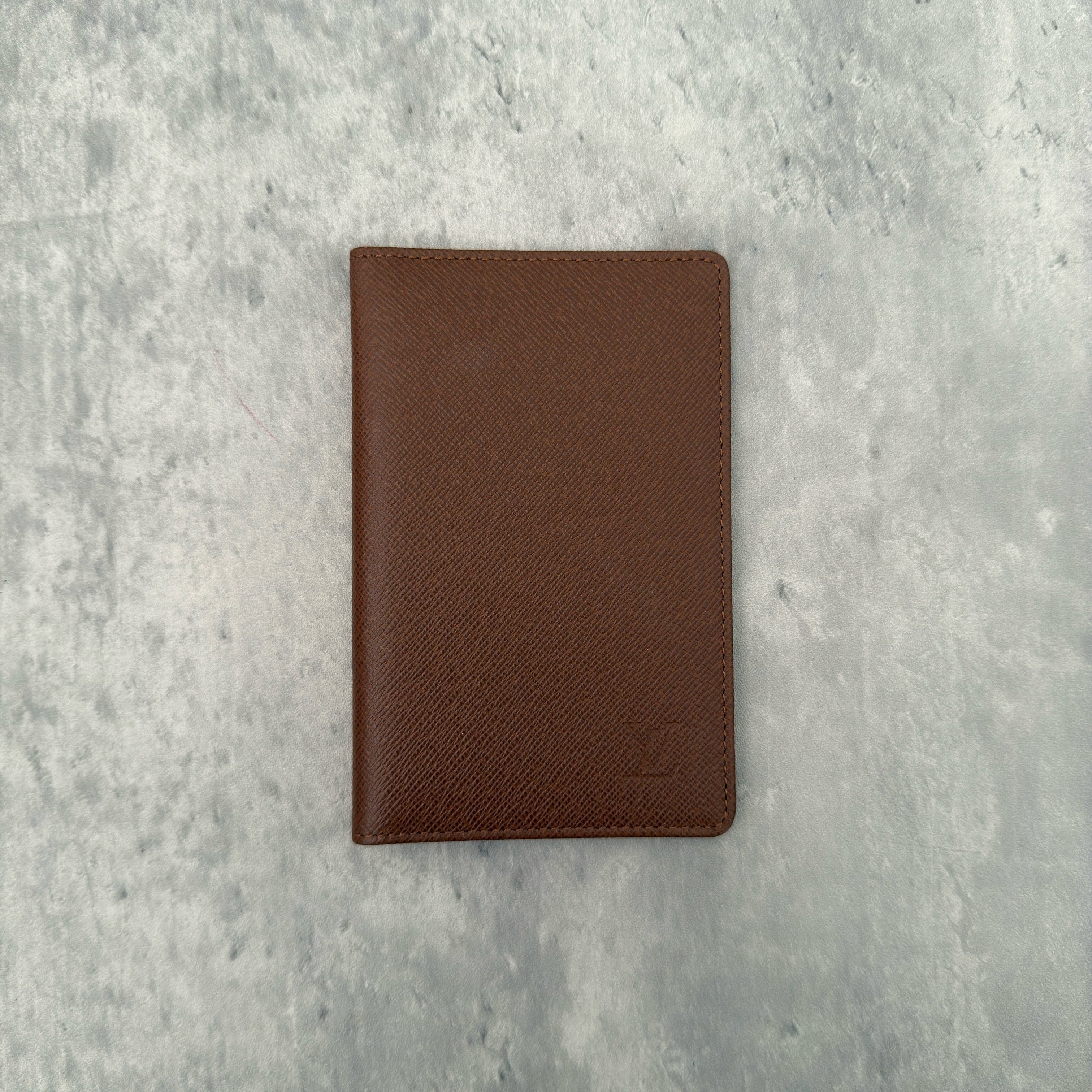 Louis Vuitton Vintage Brown Leather Cardholder with embossed LV logo and multiple card slots.