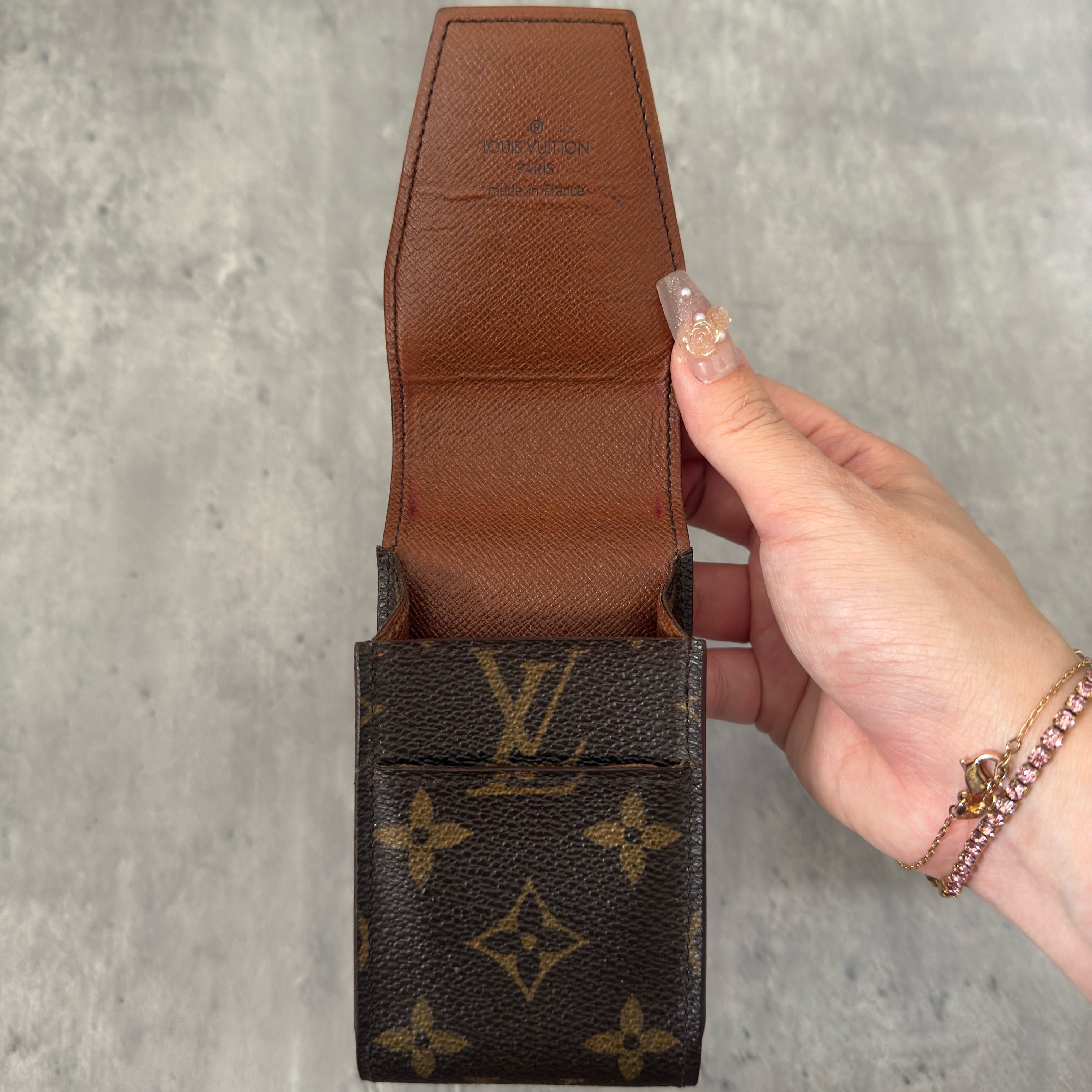 Louis Vuitton Vintage Monogram Cigarette Case in brown coated canvas with signature monogram pattern and leather-lined interior.