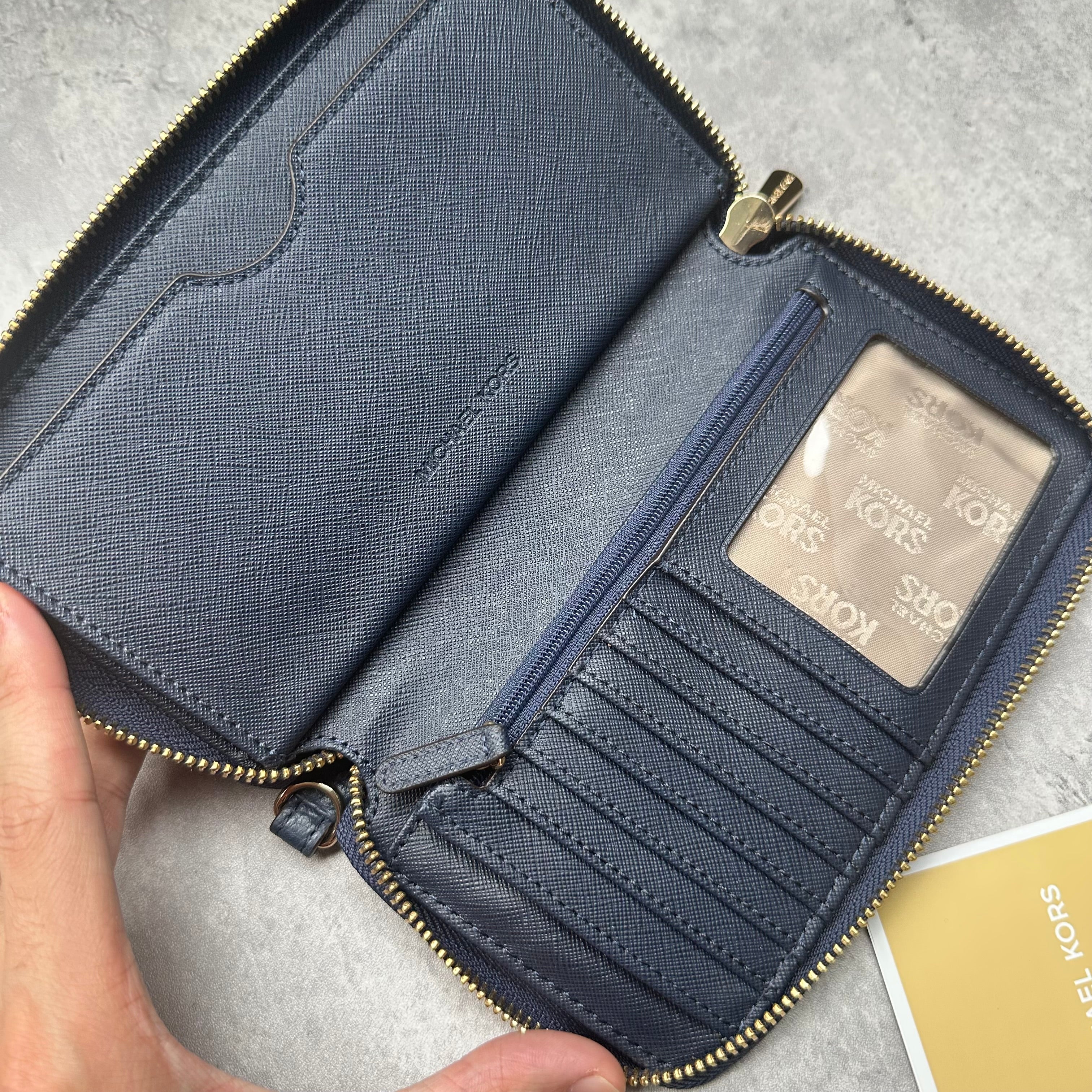 Michael Kors Fulton Leather Zip Wallet, pebbled texture with gold MK logo and zip closure