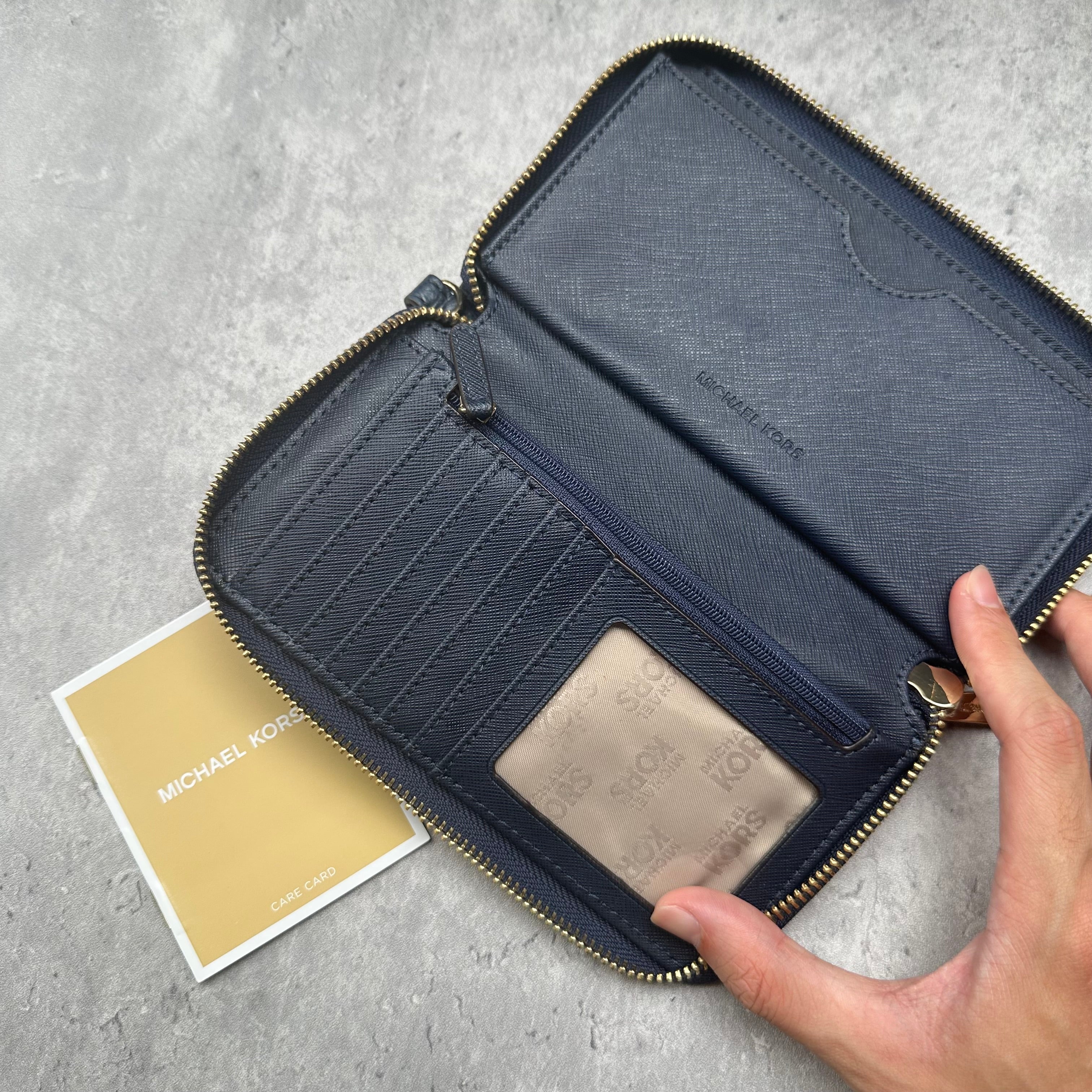 Michael Kors Fulton Leather Zip Wallet, pebbled texture with gold MK logo and zip closure