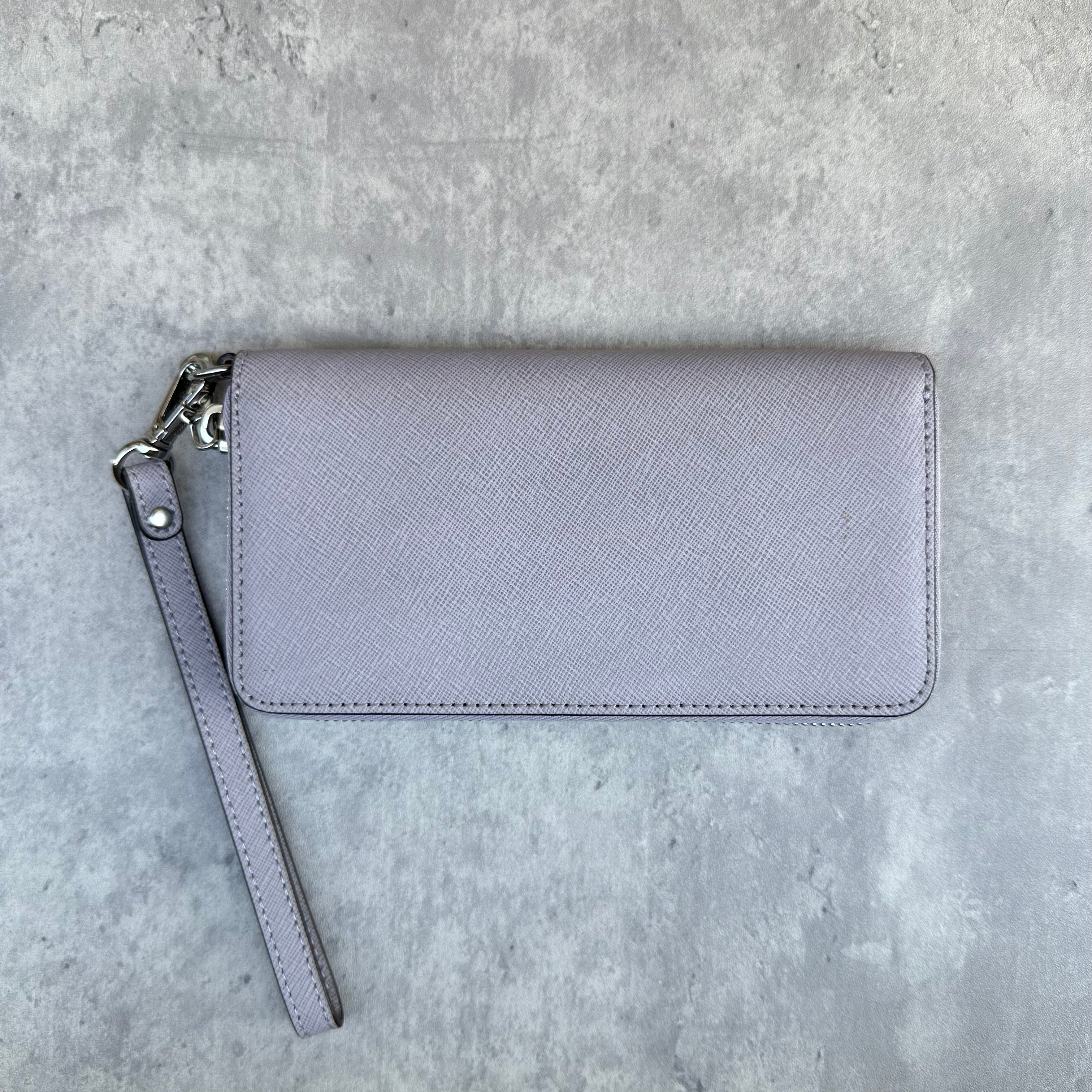 Michael Kors Jet Set Travel Wristlet Wallet in saffiano leather with zip closure and detachable strap