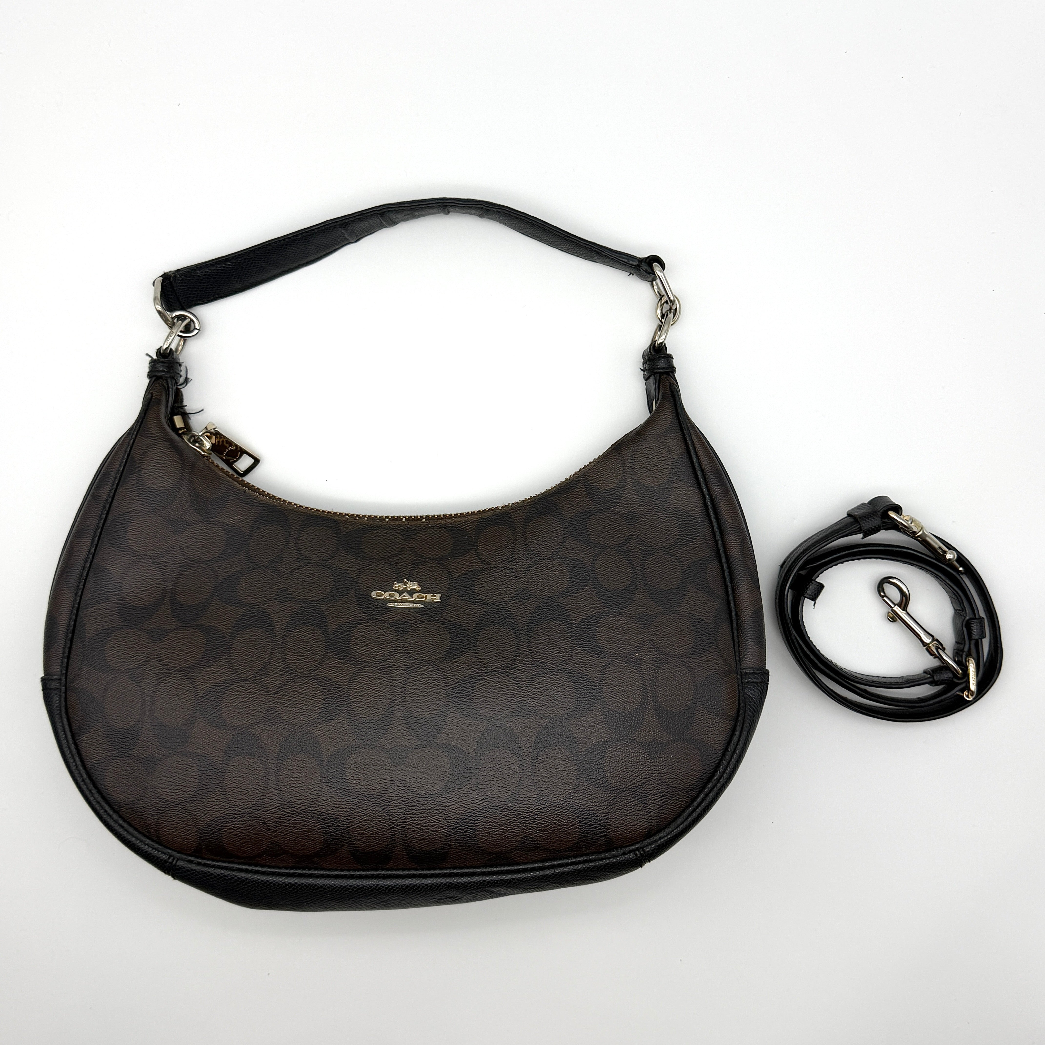 Coach Signature Hobo PVC Shoulder Bag Brown, crafted from durable monogram PVC with black leather trim and gold hardware