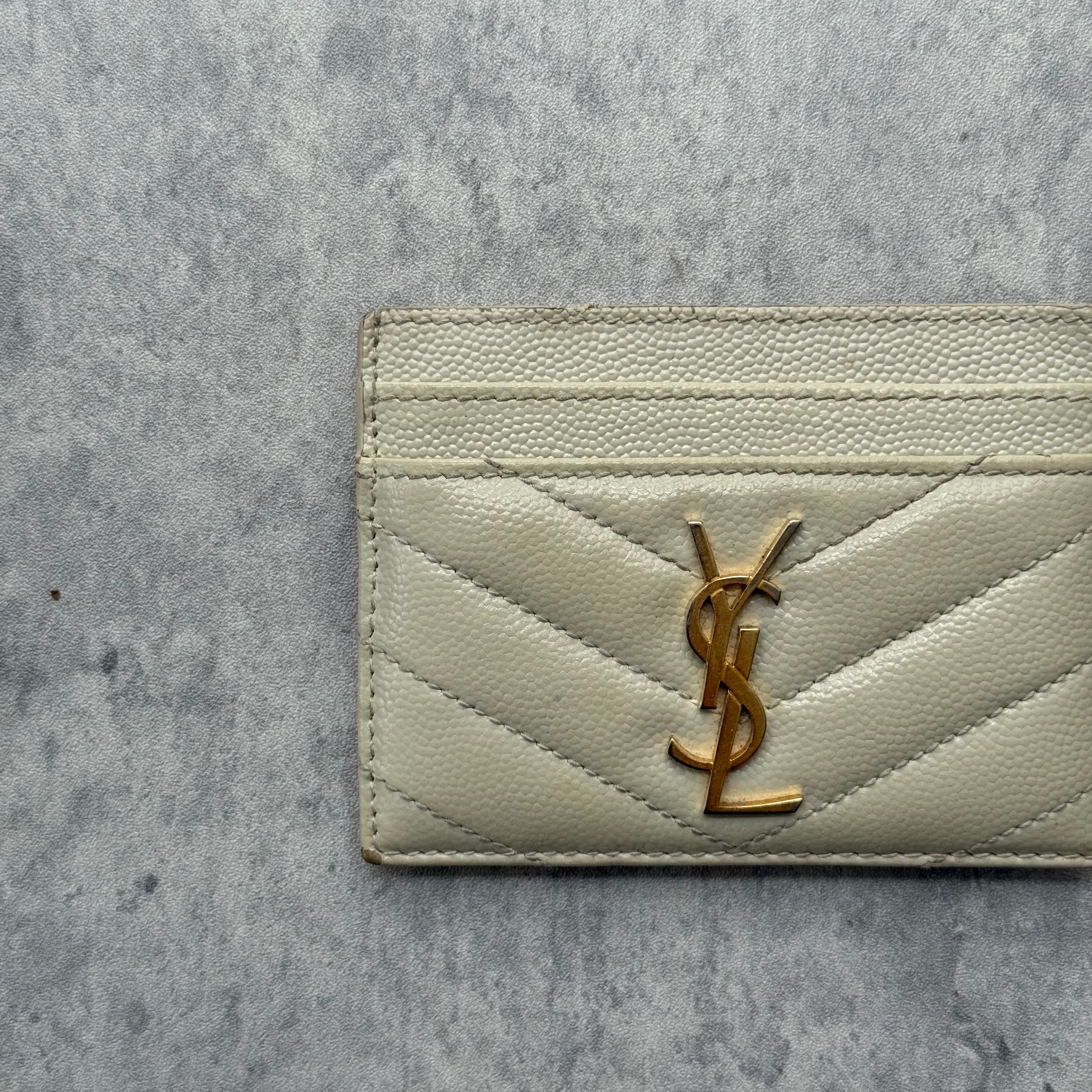 Saint Laurent Cassandre Matelassé Card Case in cream quilted leather with gold YSL logo and multiple card slots.