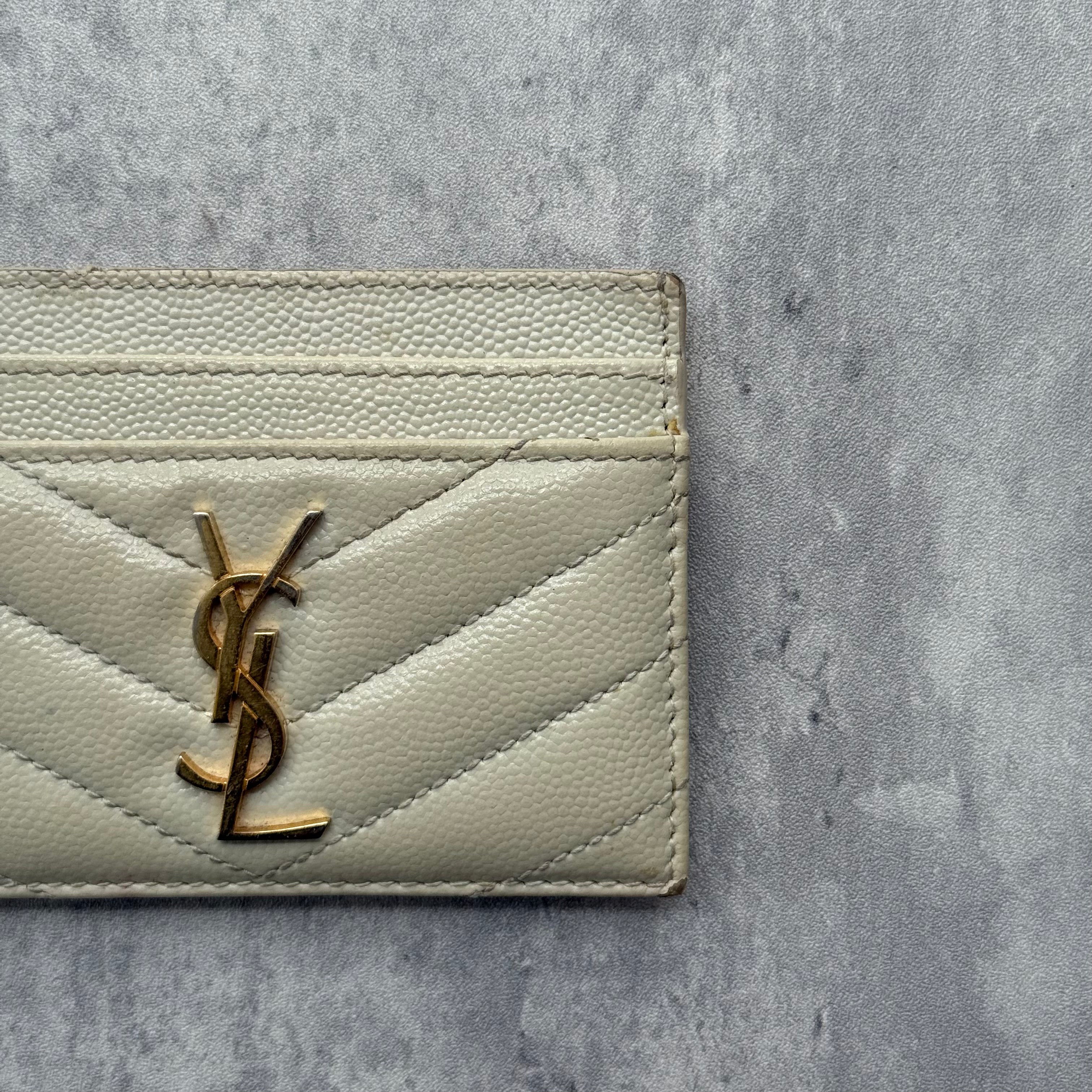 Saint Laurent Cassandre Matelassé Card Case in cream quilted leather with gold YSL logo and multiple card slots.