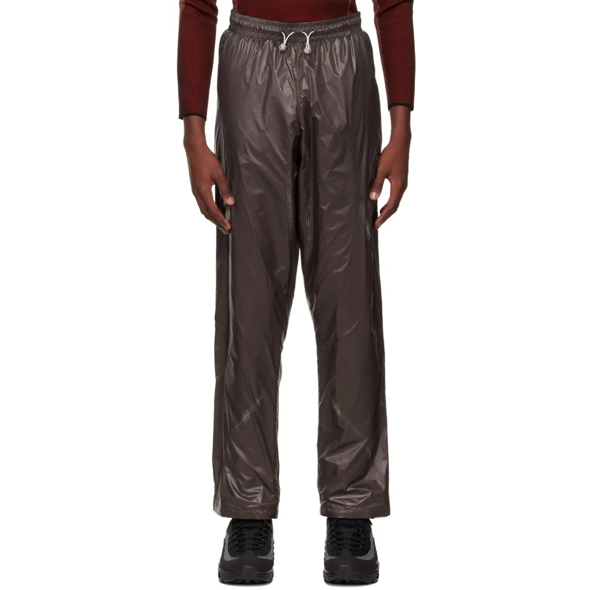 Saul Nash Perforated Trousers Brown made from lightweight nylon with subtle sheen, relaxed fit, and elastic waistband