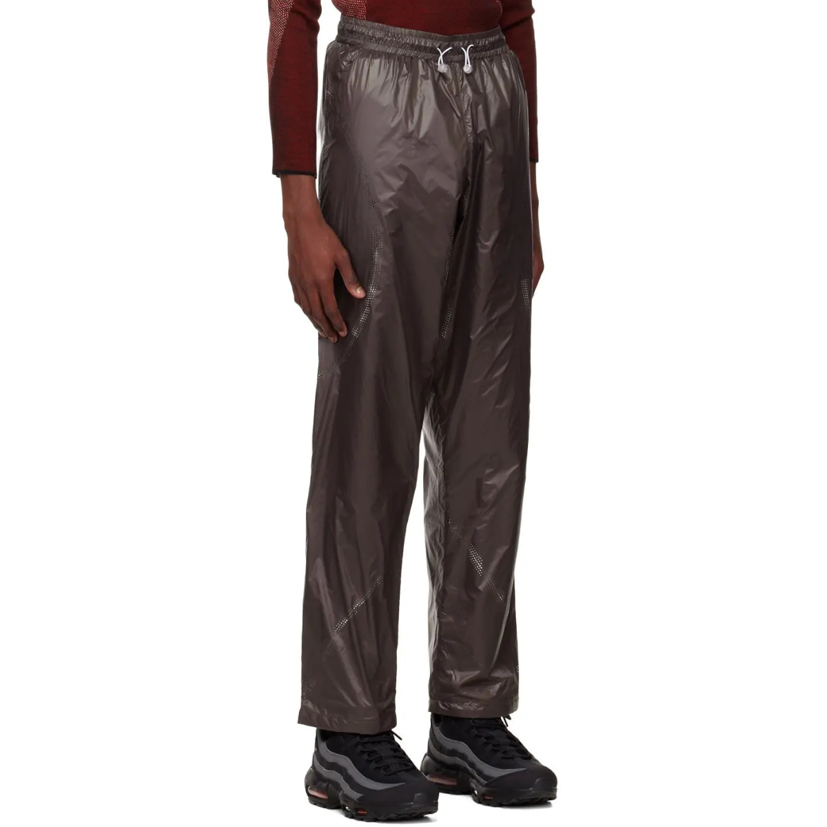 Saul Nash Perforated Trousers Brown made from lightweight nylon with subtle sheen, relaxed fit, and elastic waistband