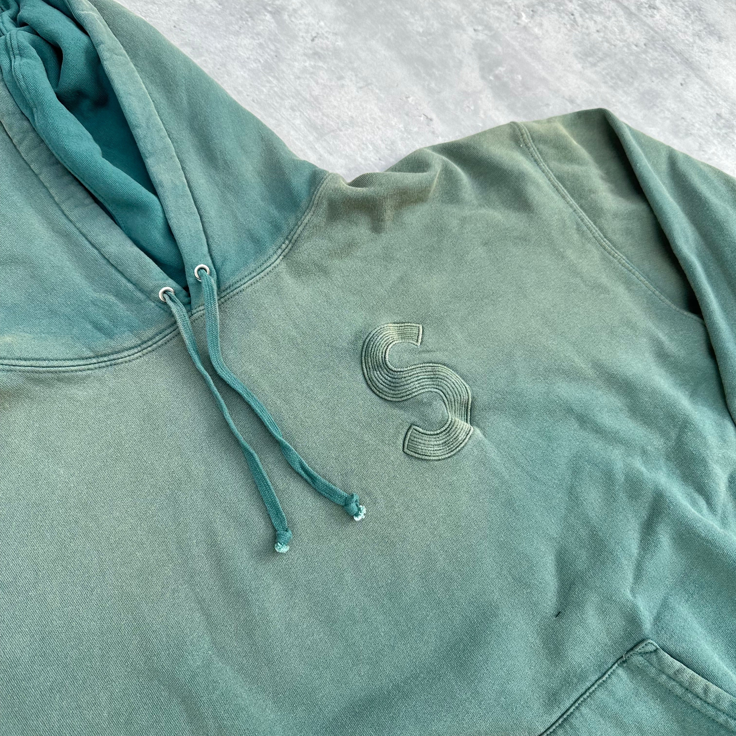 Supreme Overdyed S Logo Hoodie in washed teal, featuring tonal embroidered S on chest with kangaroo pocket and ribbed detailing