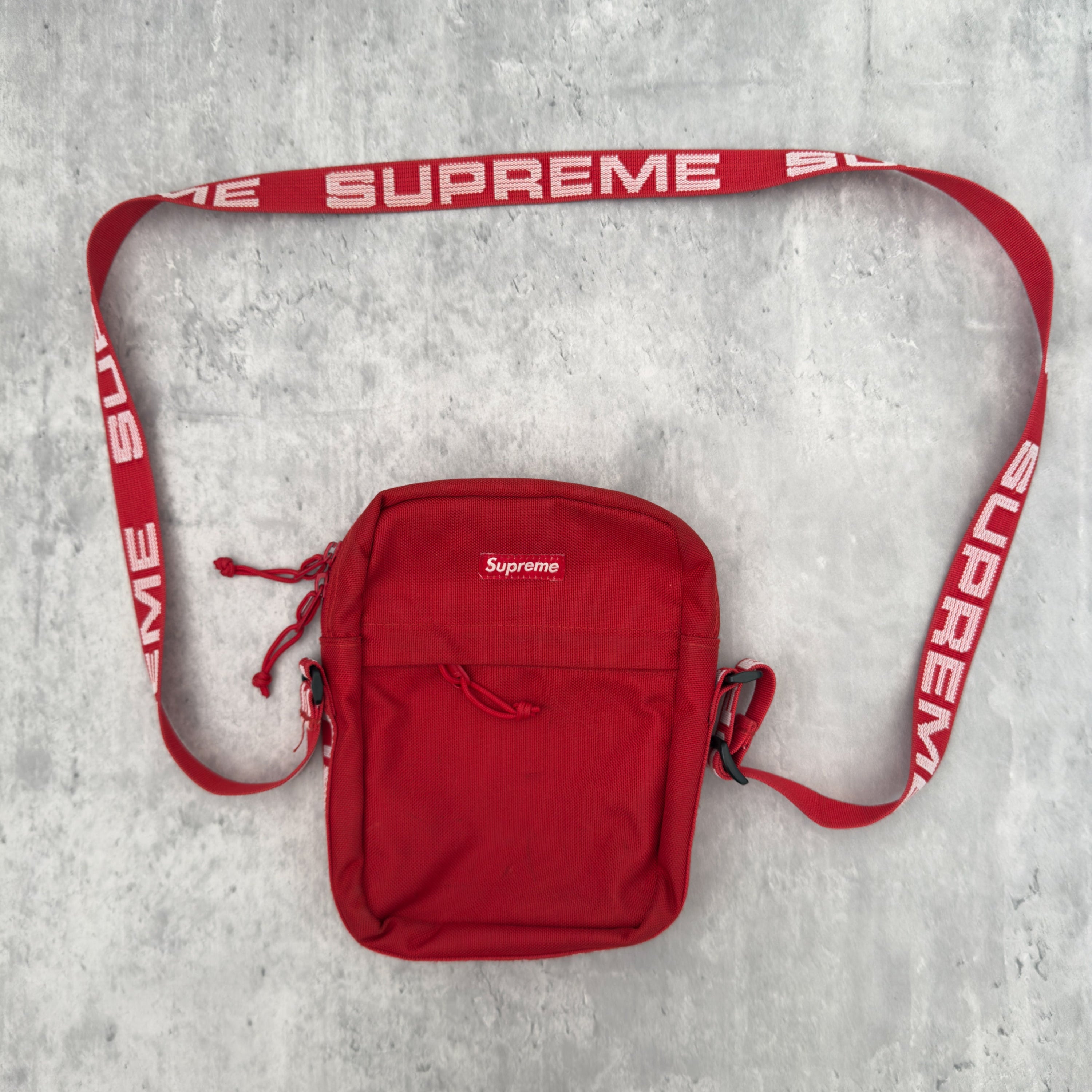 Supreme Shoulder Bag Red (SS18), made from Cordura® fabric with an adjustable Supreme-branded strap and zippered compartments.
