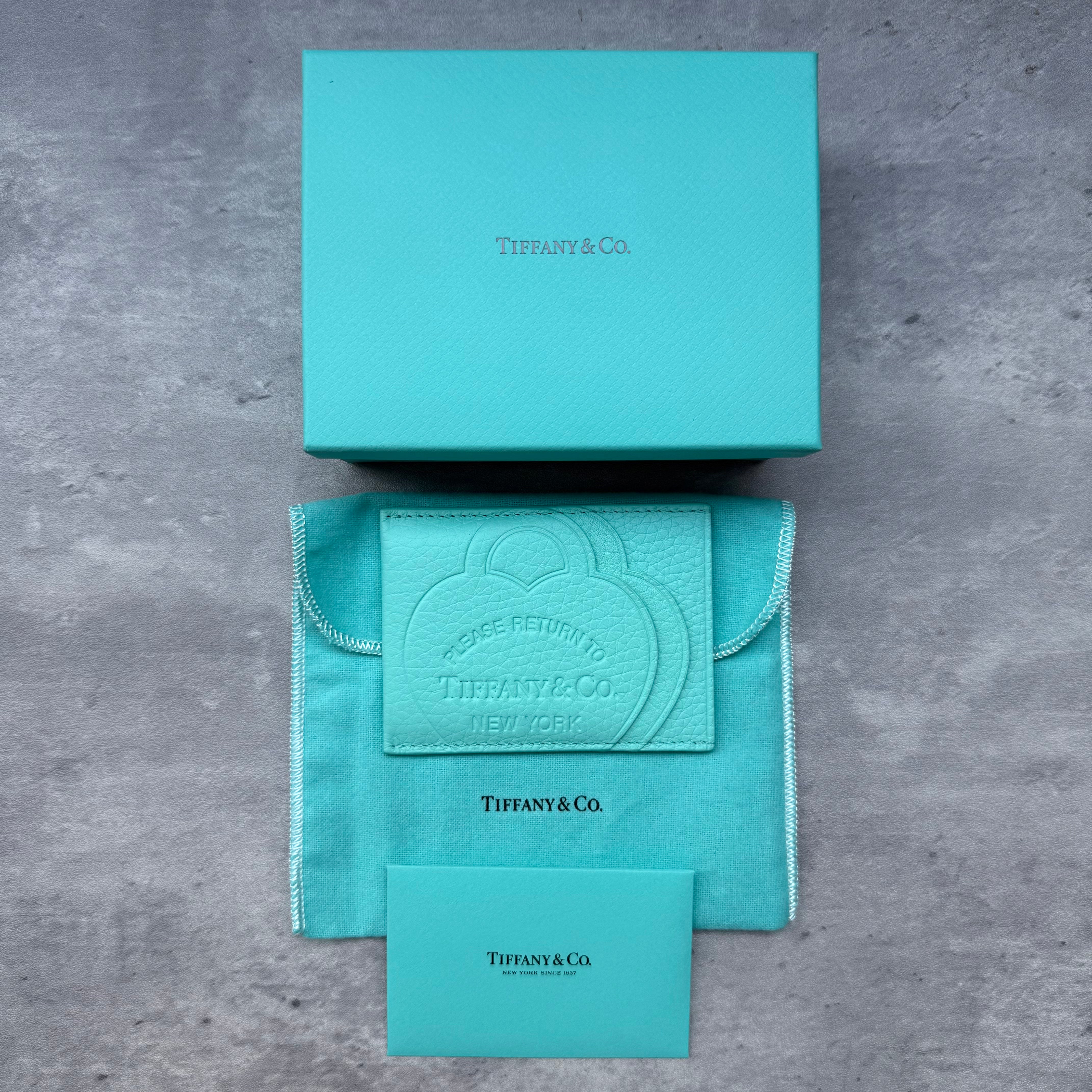 Tiffany & Co. "Return to Tiffany" Cardholder in Tiffany Blue grained leather with embossed heart design, slim silhouette and multiple card slots, brand new with box.