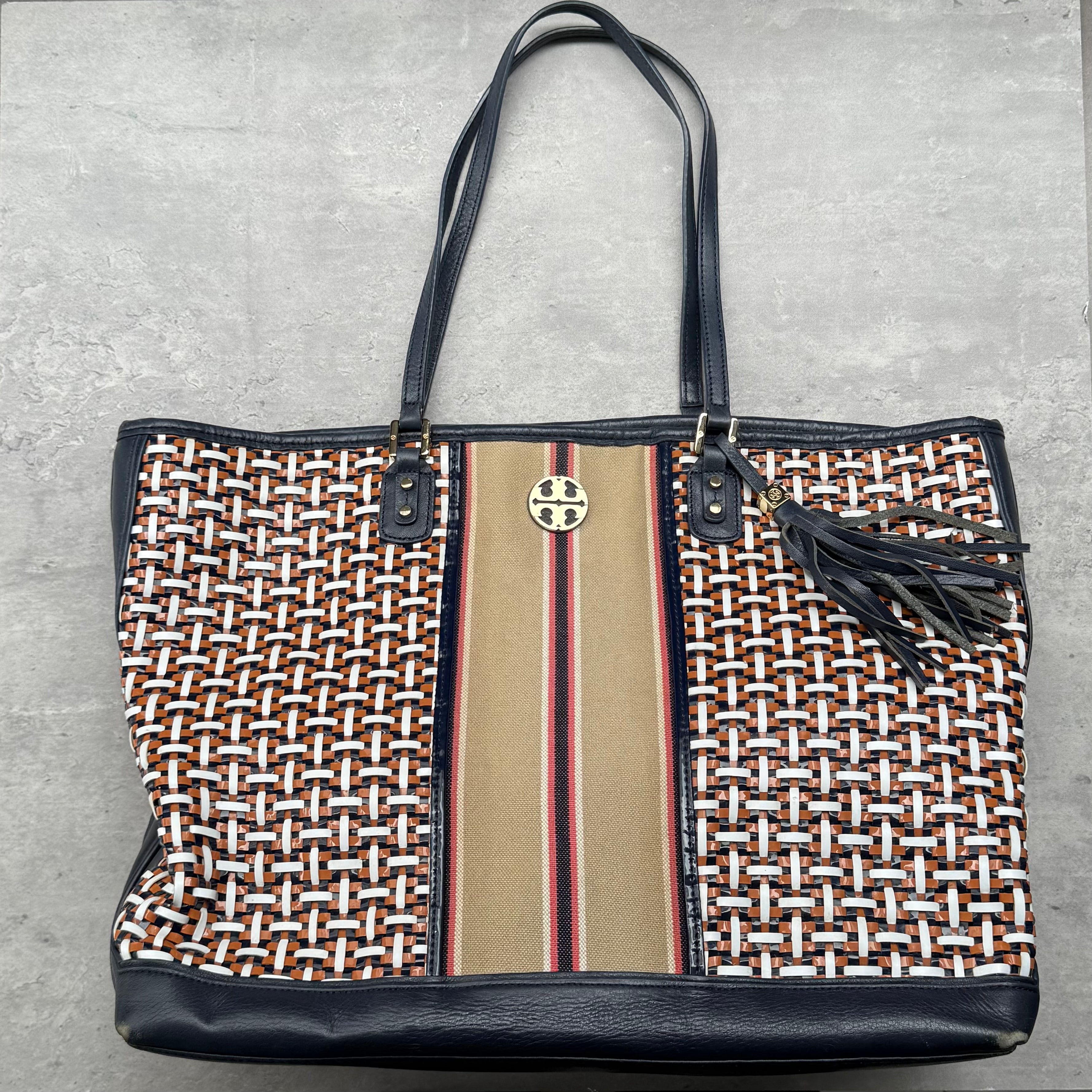 Tory Burch Gemini Link Canvas Tote Bag with multicolor chain print, striped center panel, leather trim, and gold-tone hardware.