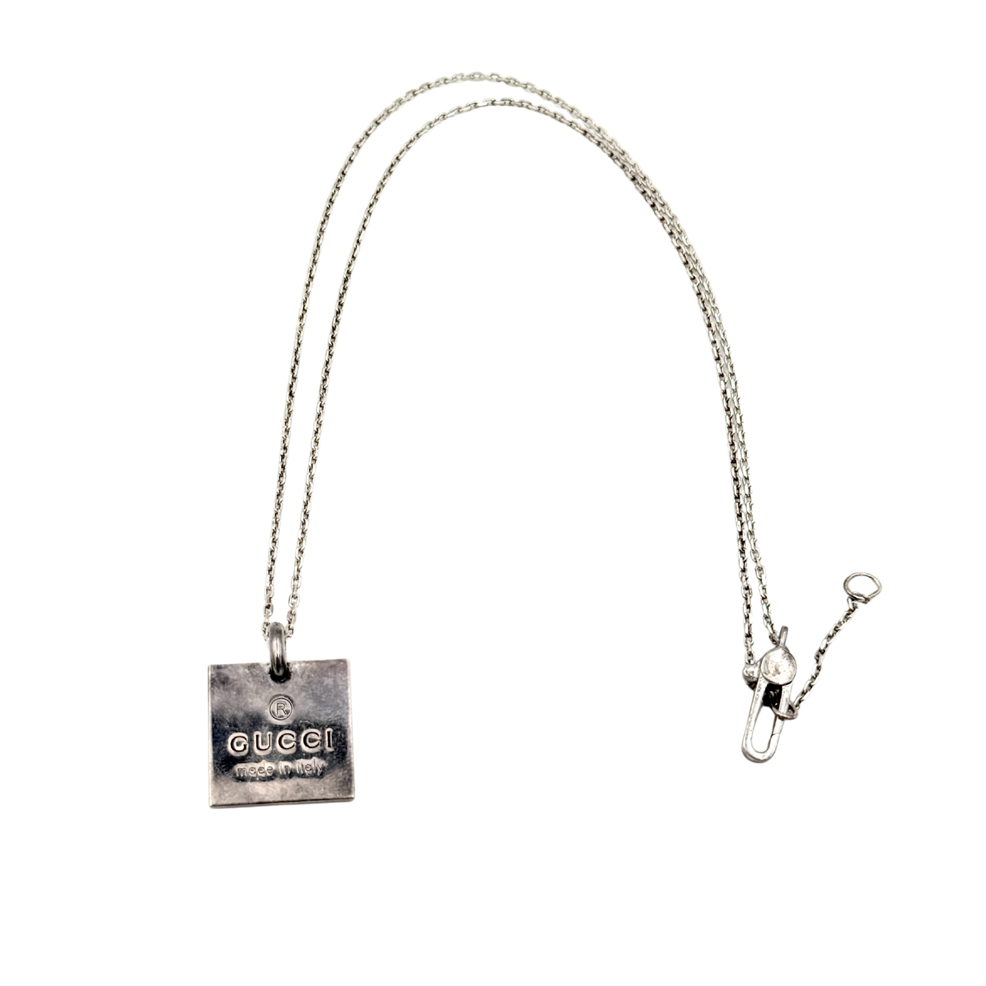 Gucci Trademark Square Plate Necklace in 925 silver with an engraved pendant and fine chain, artfully displayed against a clean background.